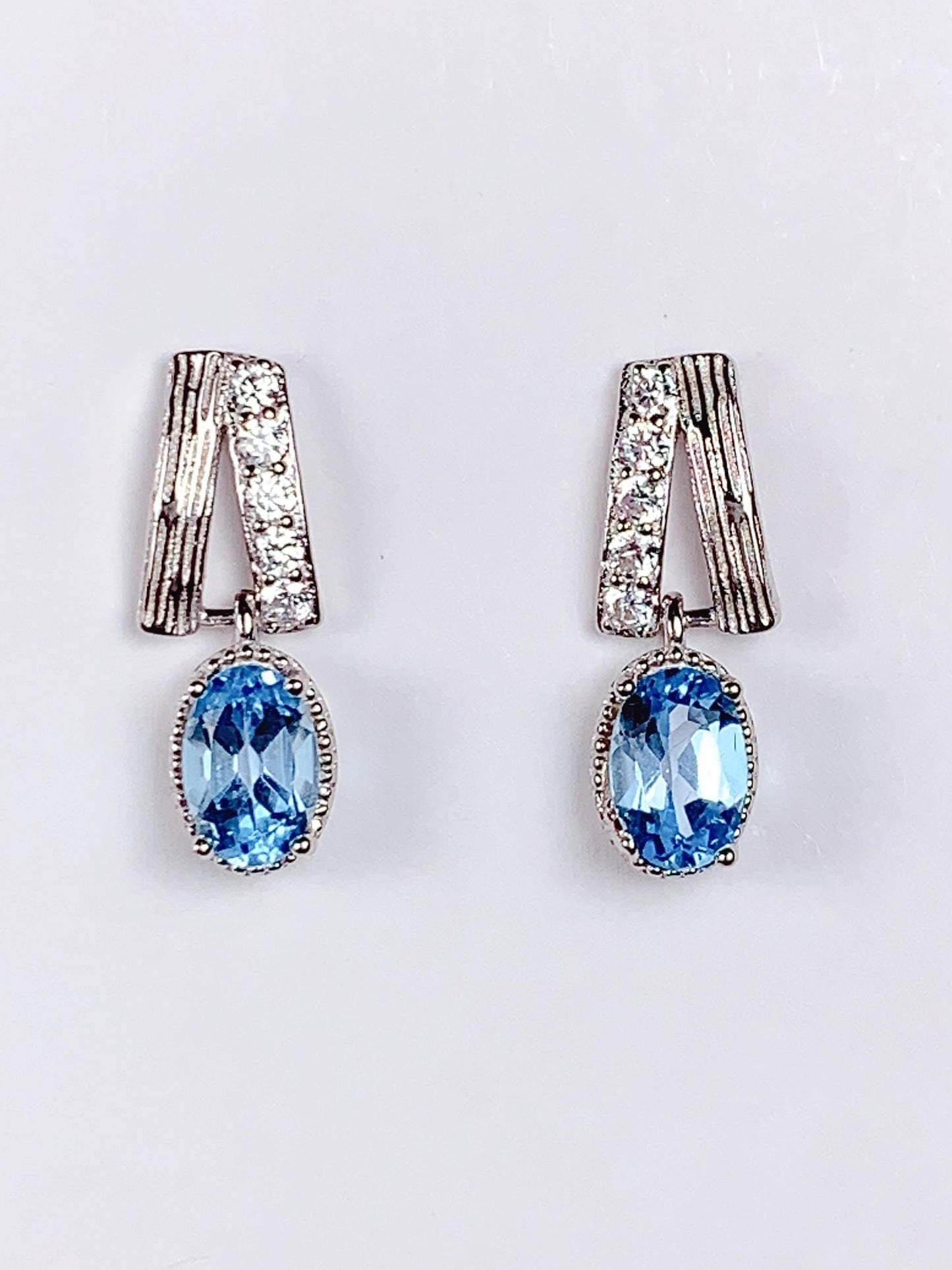 Skype Blue Topaz Earrings: Oval Cut, 18k Gold Plated Sterling Silver