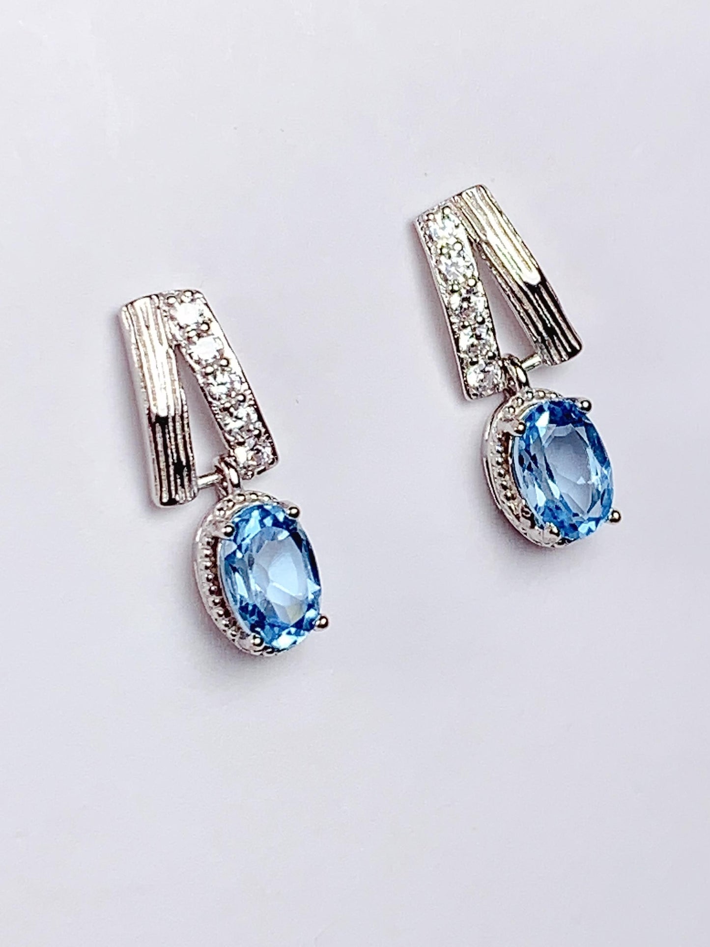 Skype Blue Topaz Earrings: Oval Cut, 18k Gold Plated Sterling Silver