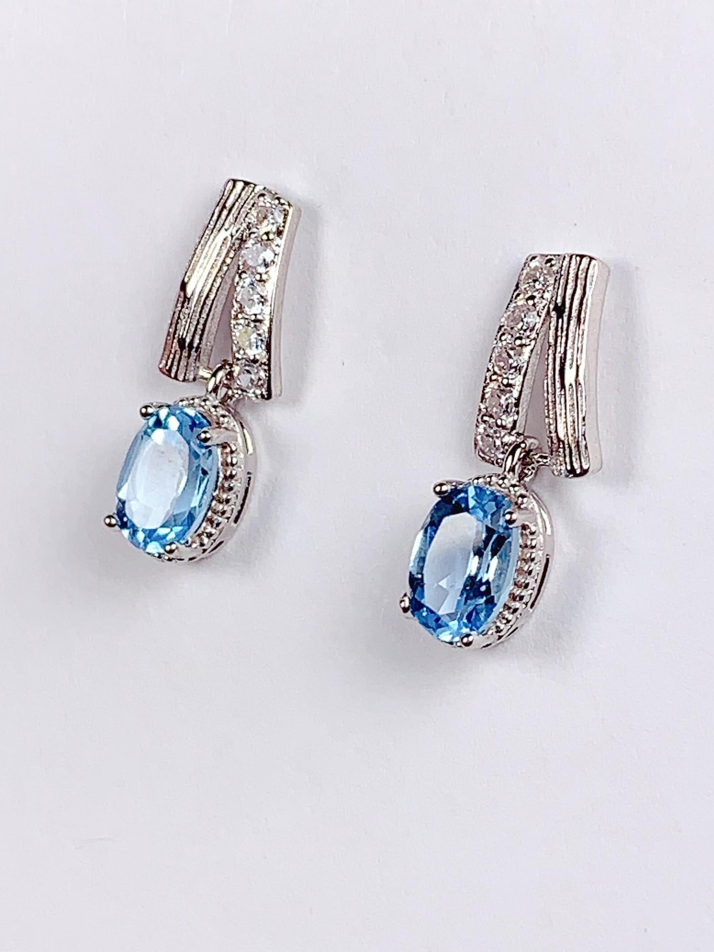 Skype Blue Topaz Earrings: Oval Cut, 18k Gold Plated Sterling Silver