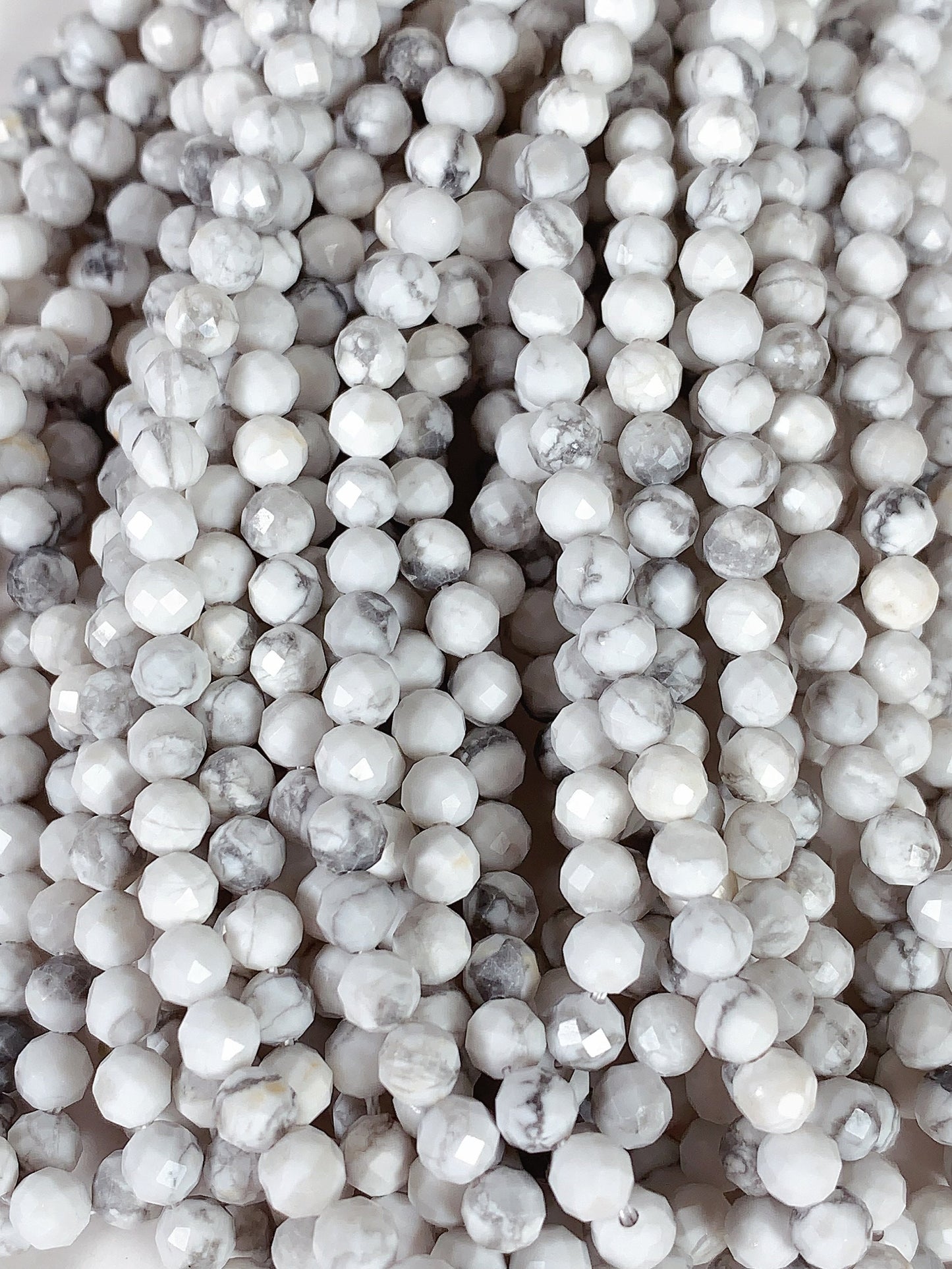 AAA+ Gray and White Howlite Faceted Round Beads - 15.5" Strand