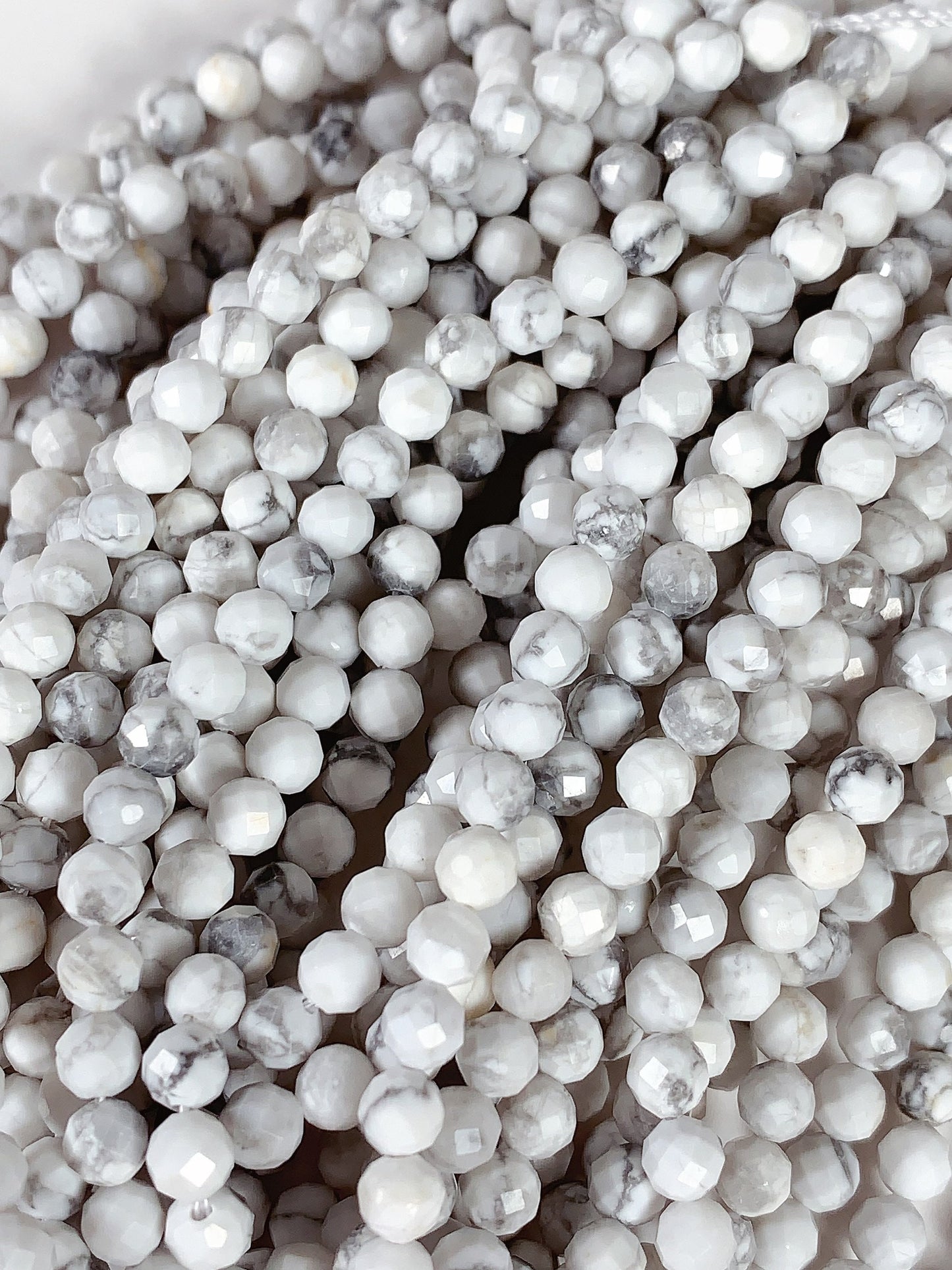 AAA+ Gray and White Howlite Faceted Round Beads - 15.5" Strand