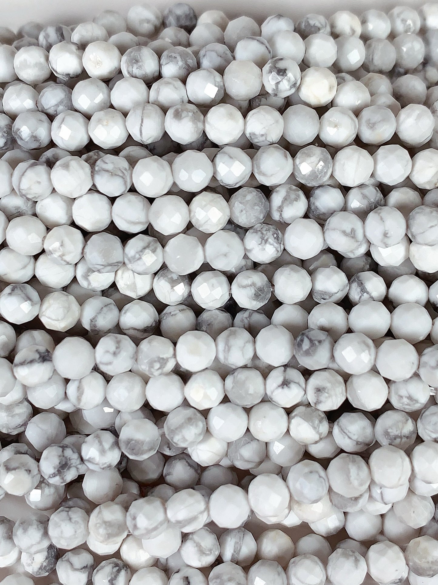 AAA+ Gray and White Howlite Faceted Round Beads - 15.5" Strand