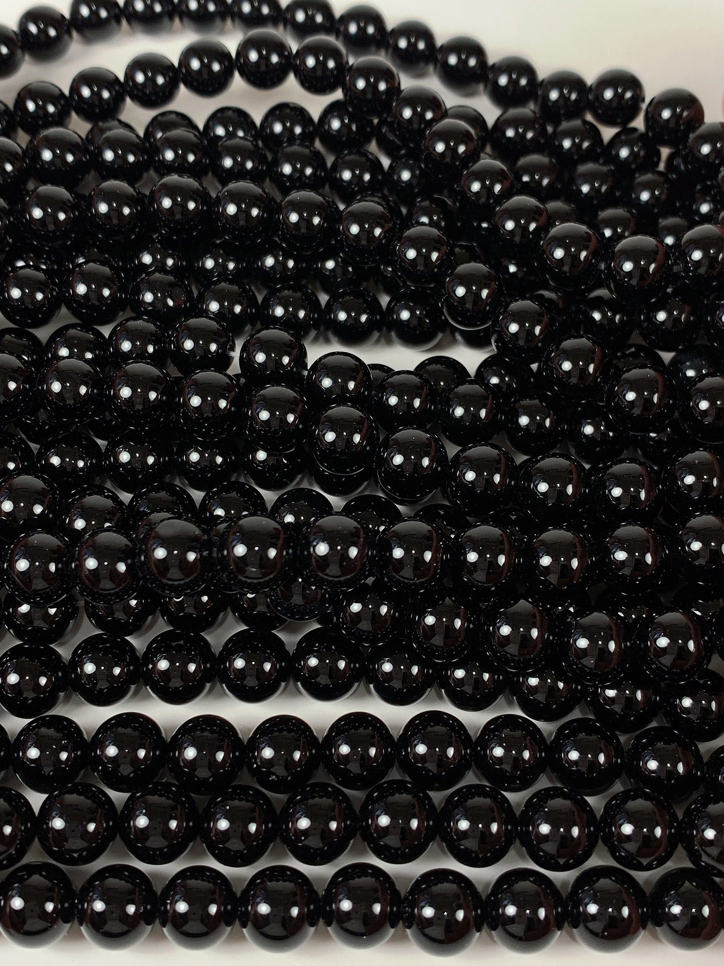 AAA Black Onyx Beads: 15.5" Smooth Round Gemstone Strand