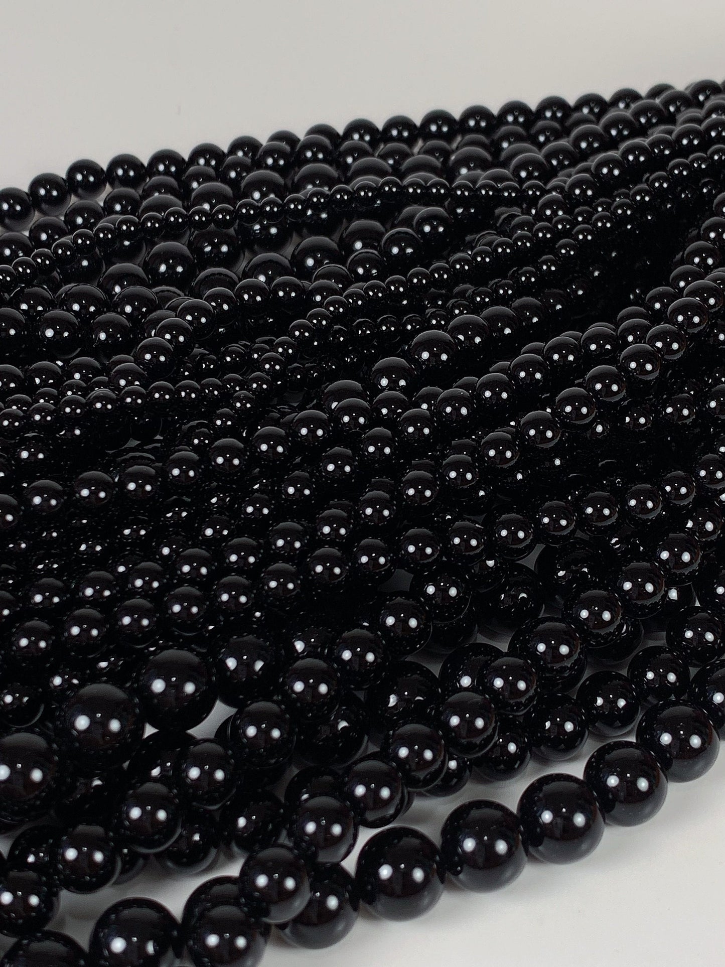 AAA Black Onyx Beads: 15.5" Smooth Round Gemstone Strand