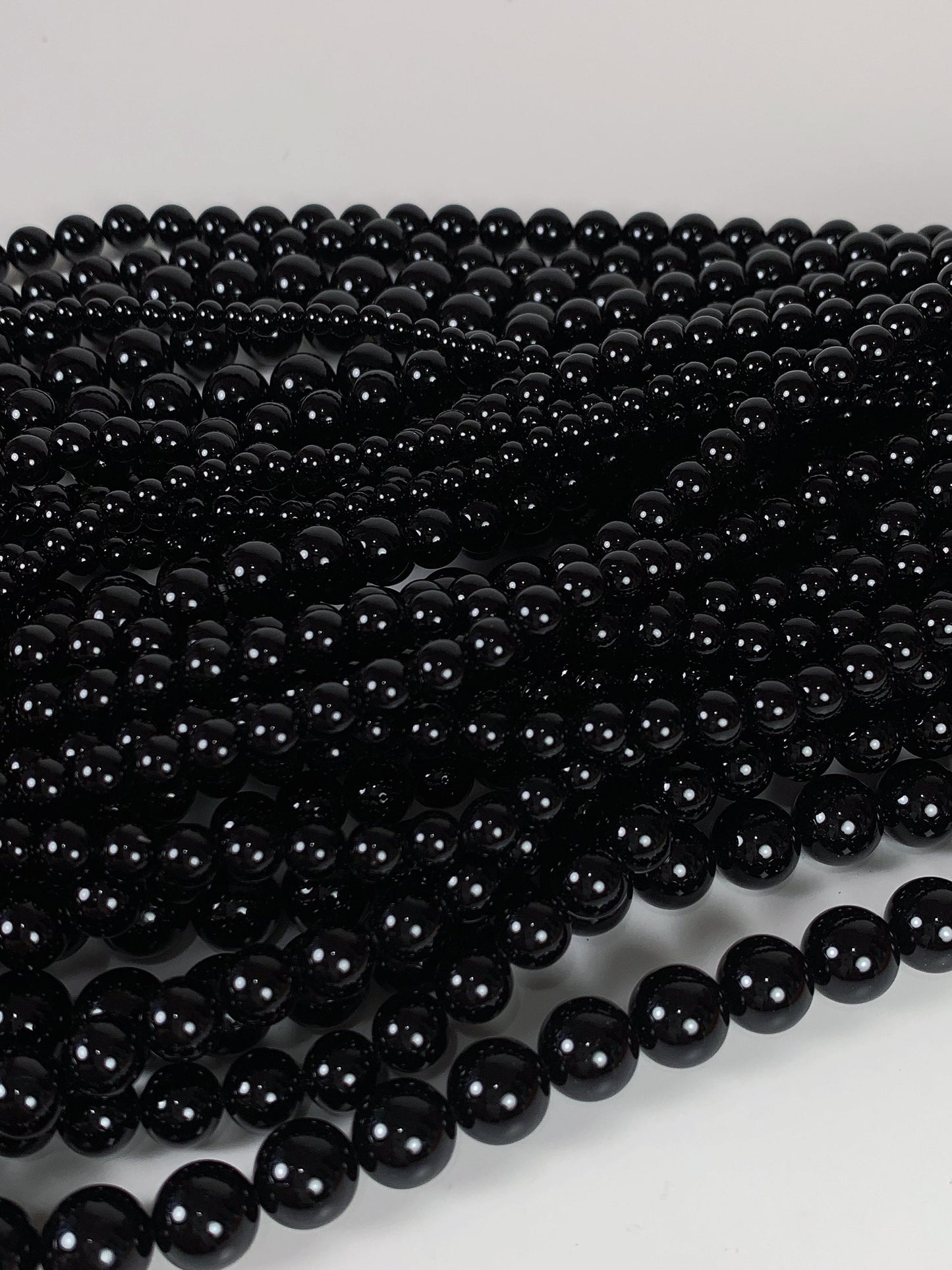 AAA Black Onyx Beads: 15.5" Smooth Round Gemstone Strand
