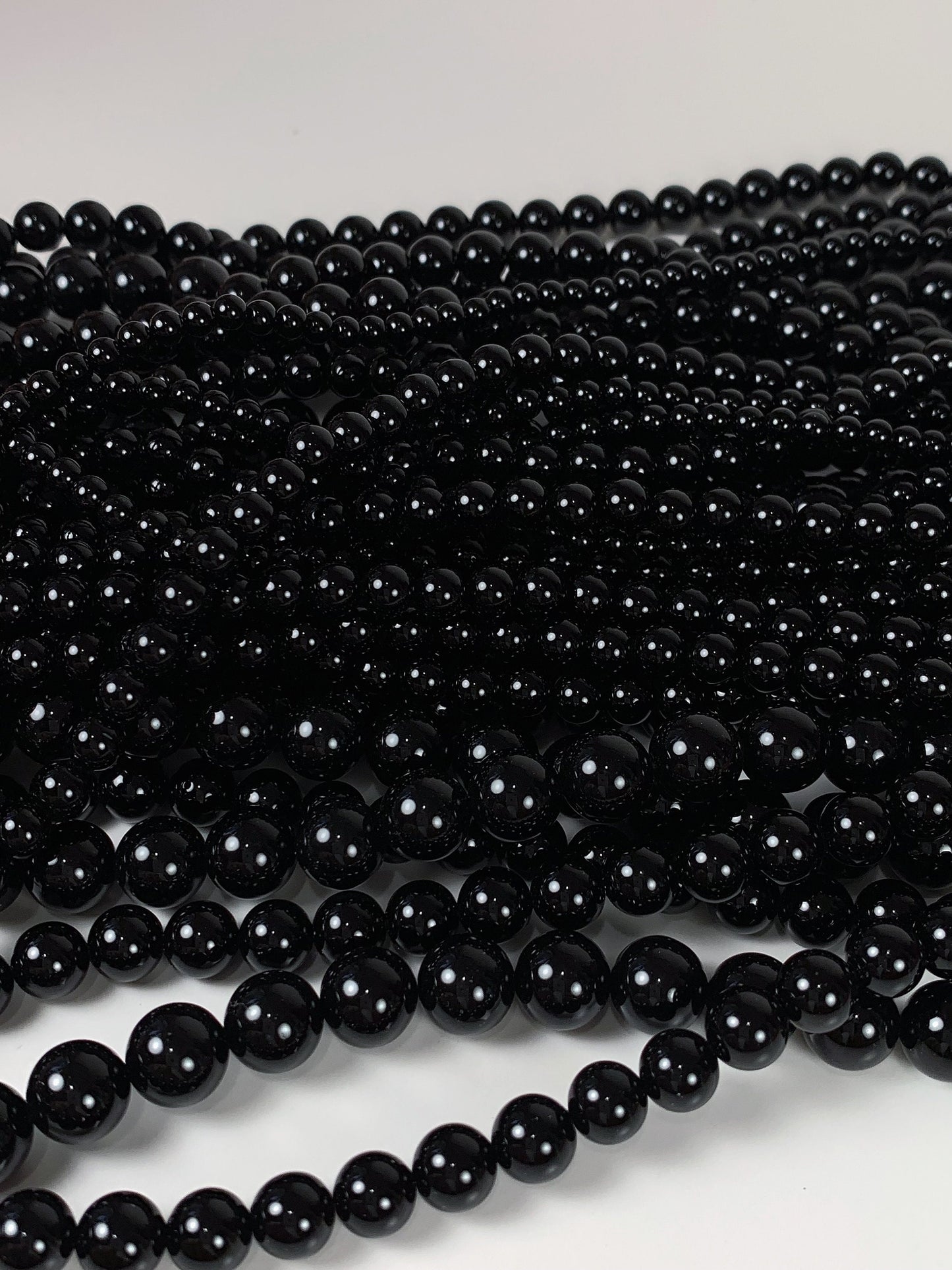 AAA Black Onyx Beads: 15.5" Smooth Round Gemstone Strand