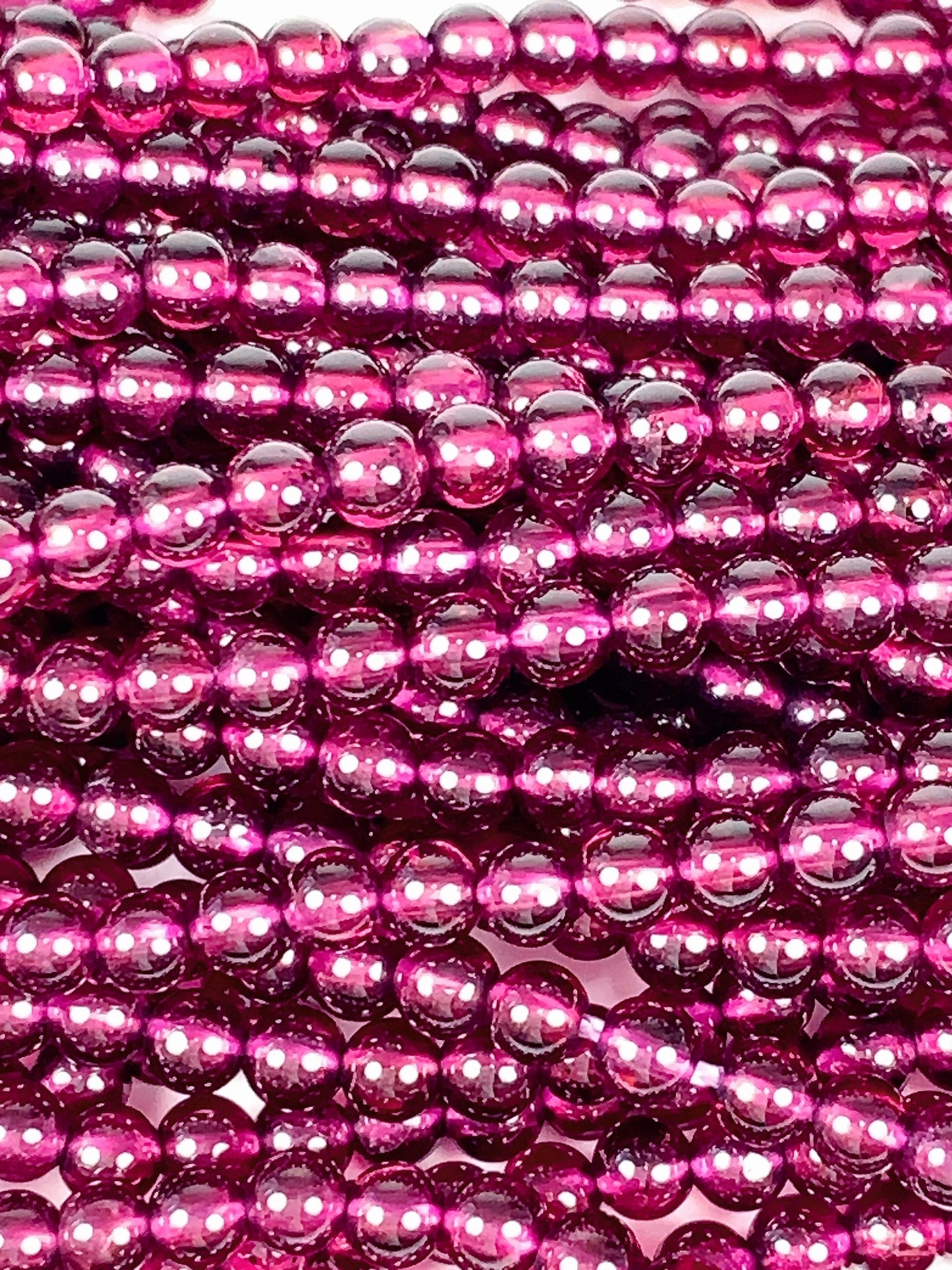 AAA Mozambique Purple Garnet Beads: Natural Smooth Round Gemstone, 15.5" Strand