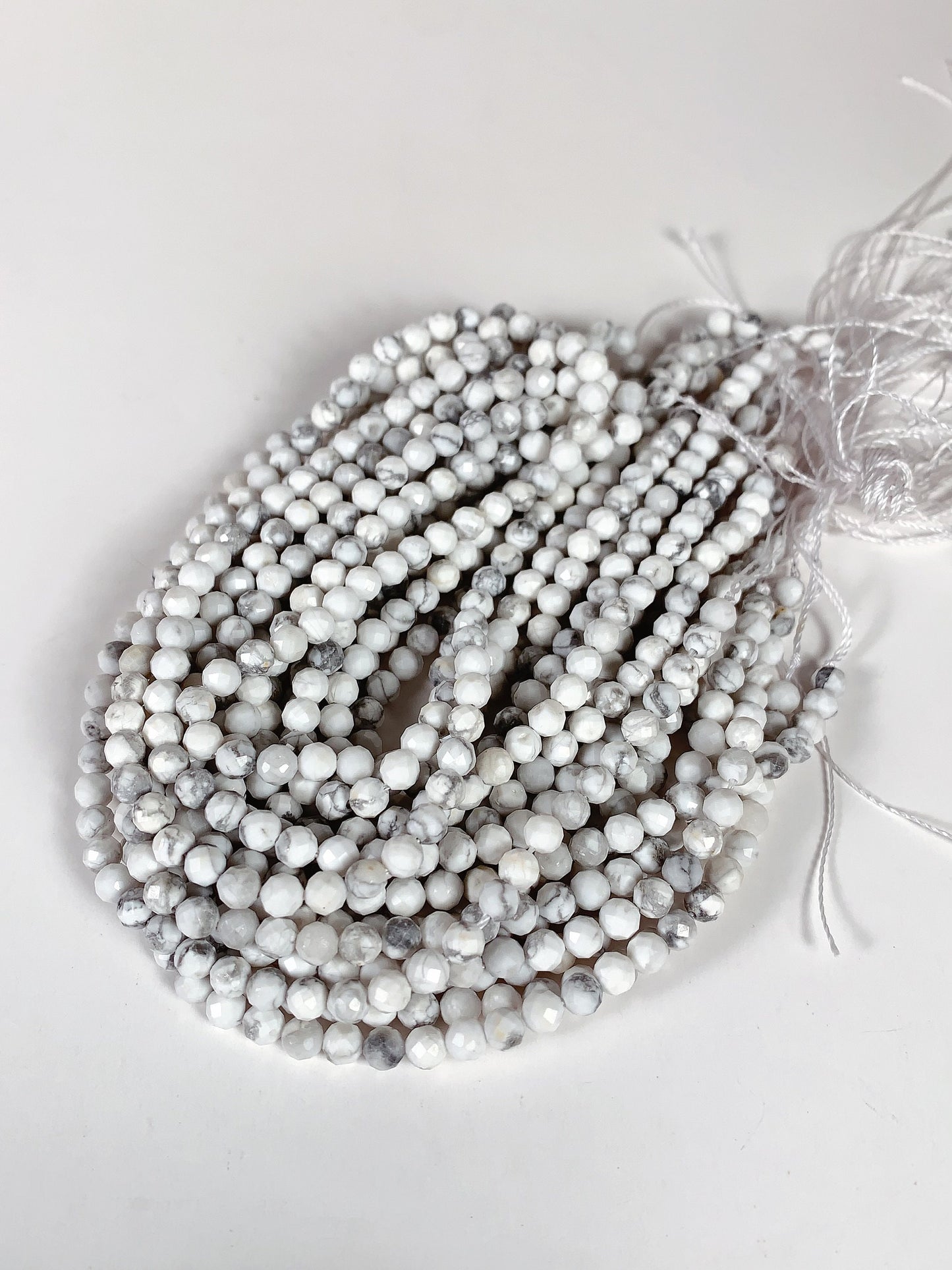 AAA+ Gray and White Howlite Faceted Round Beads - 15.5" Strand