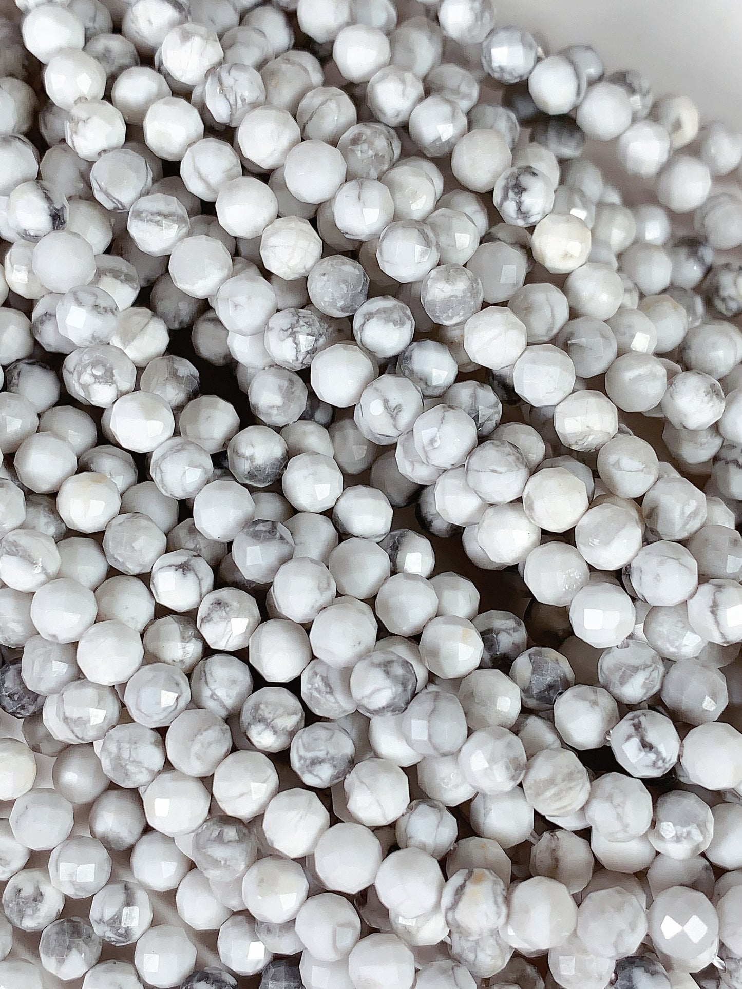 AAA+ Gray and White Howlite Faceted Round Beads - 15.5" Strand