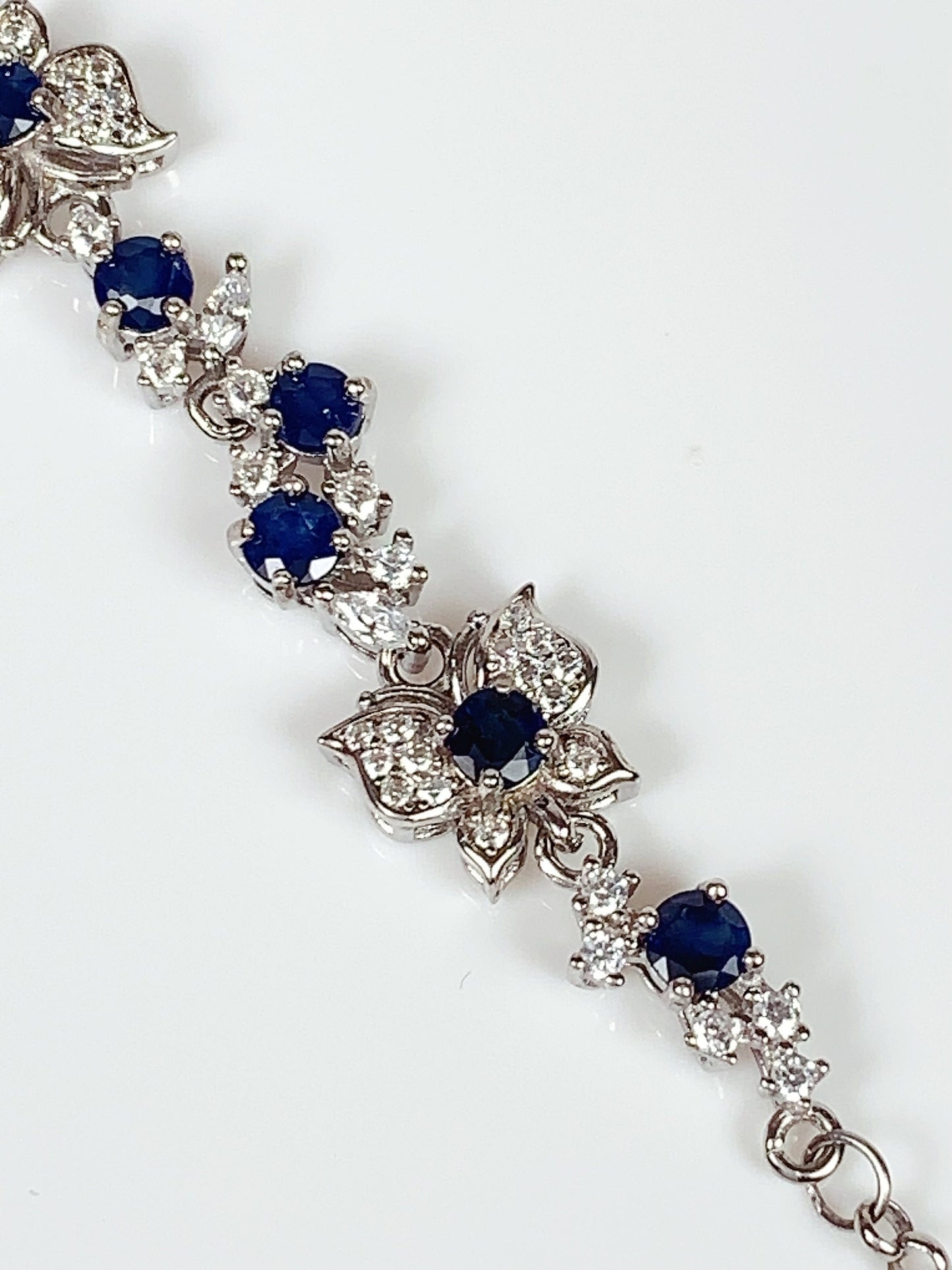Blue Sapphire Floral Bracelet: 18K White Gold Plated Sterling Silver