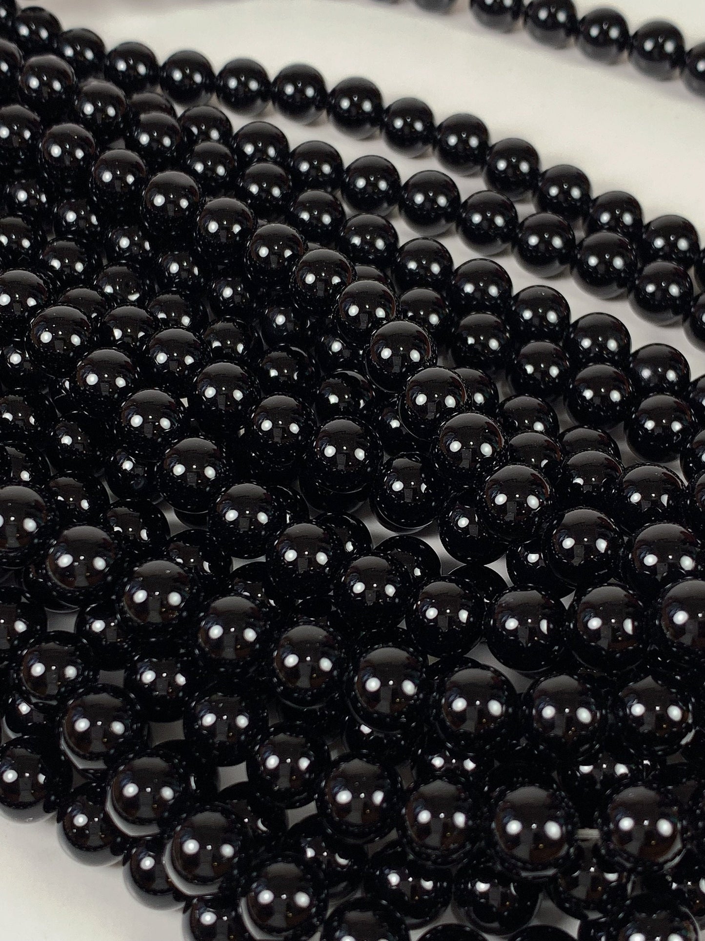 AAA Black Onyx Beads: 15.5" Smooth Round Gemstone Strand