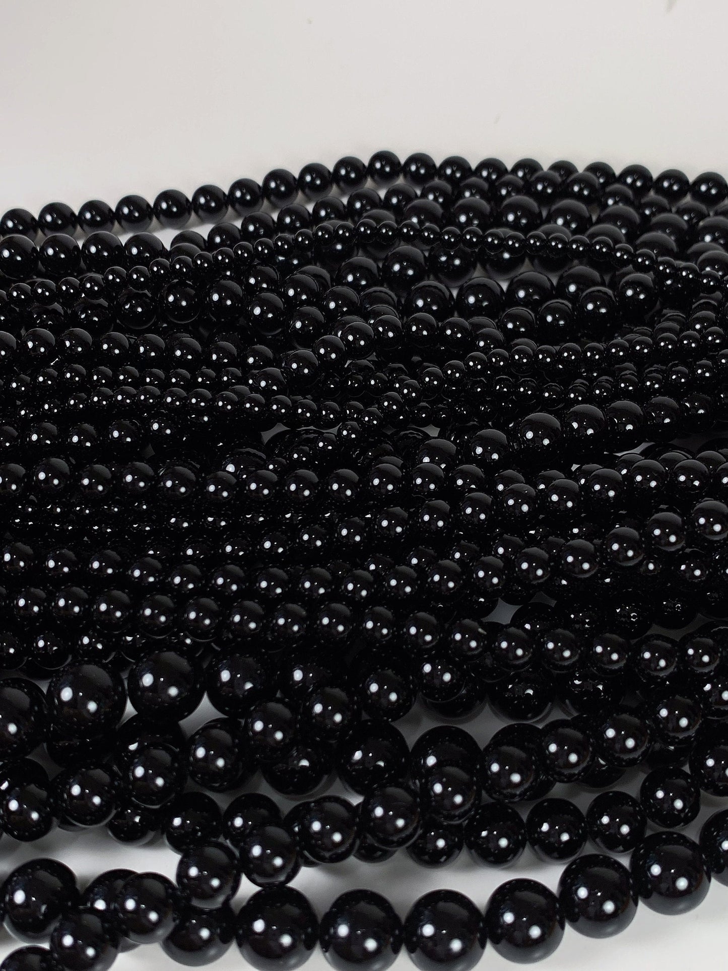 AAA Black Onyx Beads: 15.5" Smooth Round Gemstone Strand
