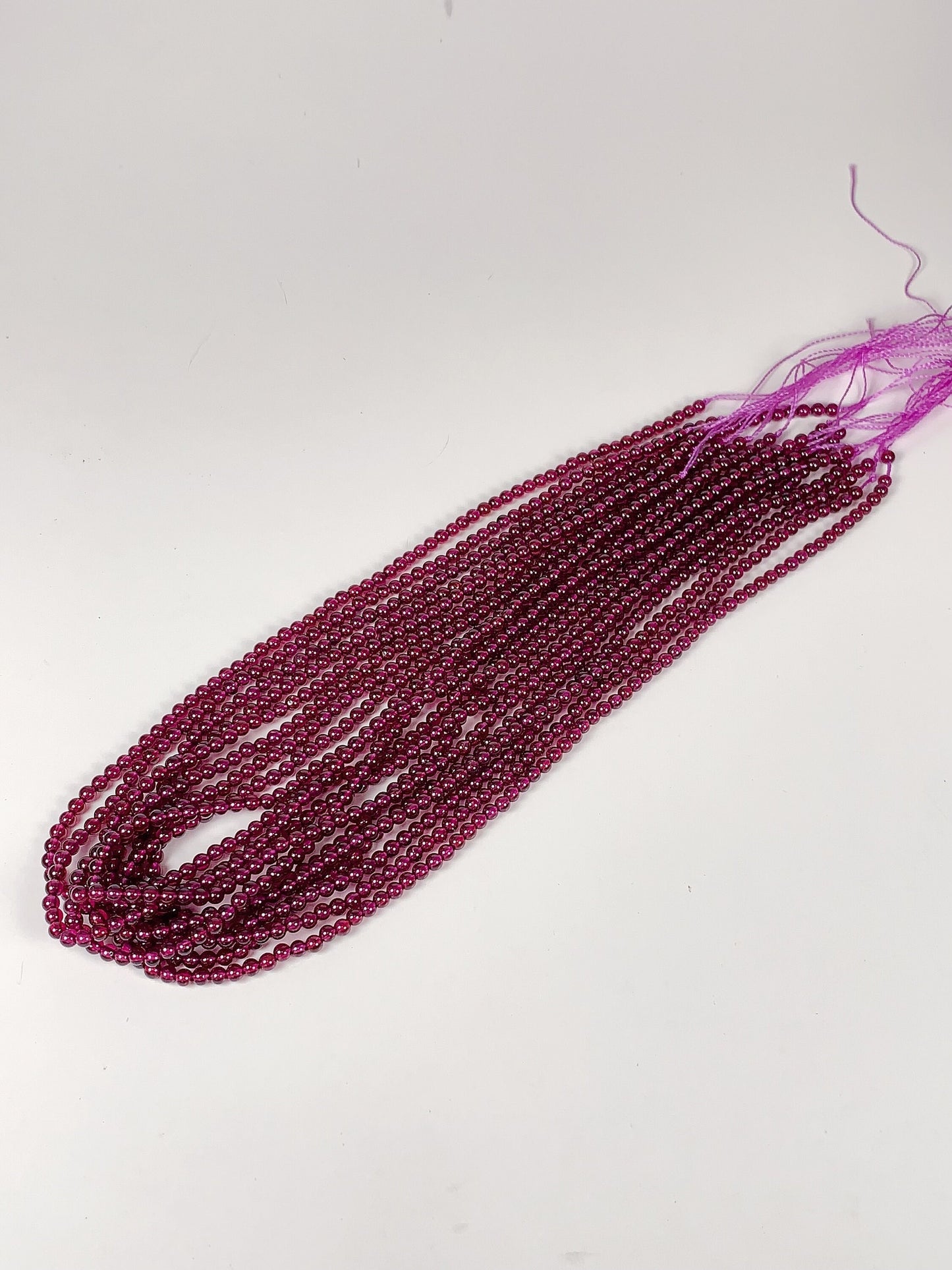 AAA Mozambique Purple Garnet Beads: Natural Smooth Round Gemstone, 15.5" Strand