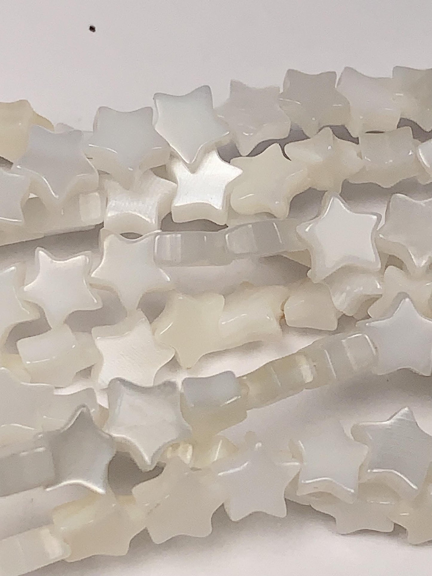 6mm AAA White Mother of Pearl Star Beads: 15" Strand