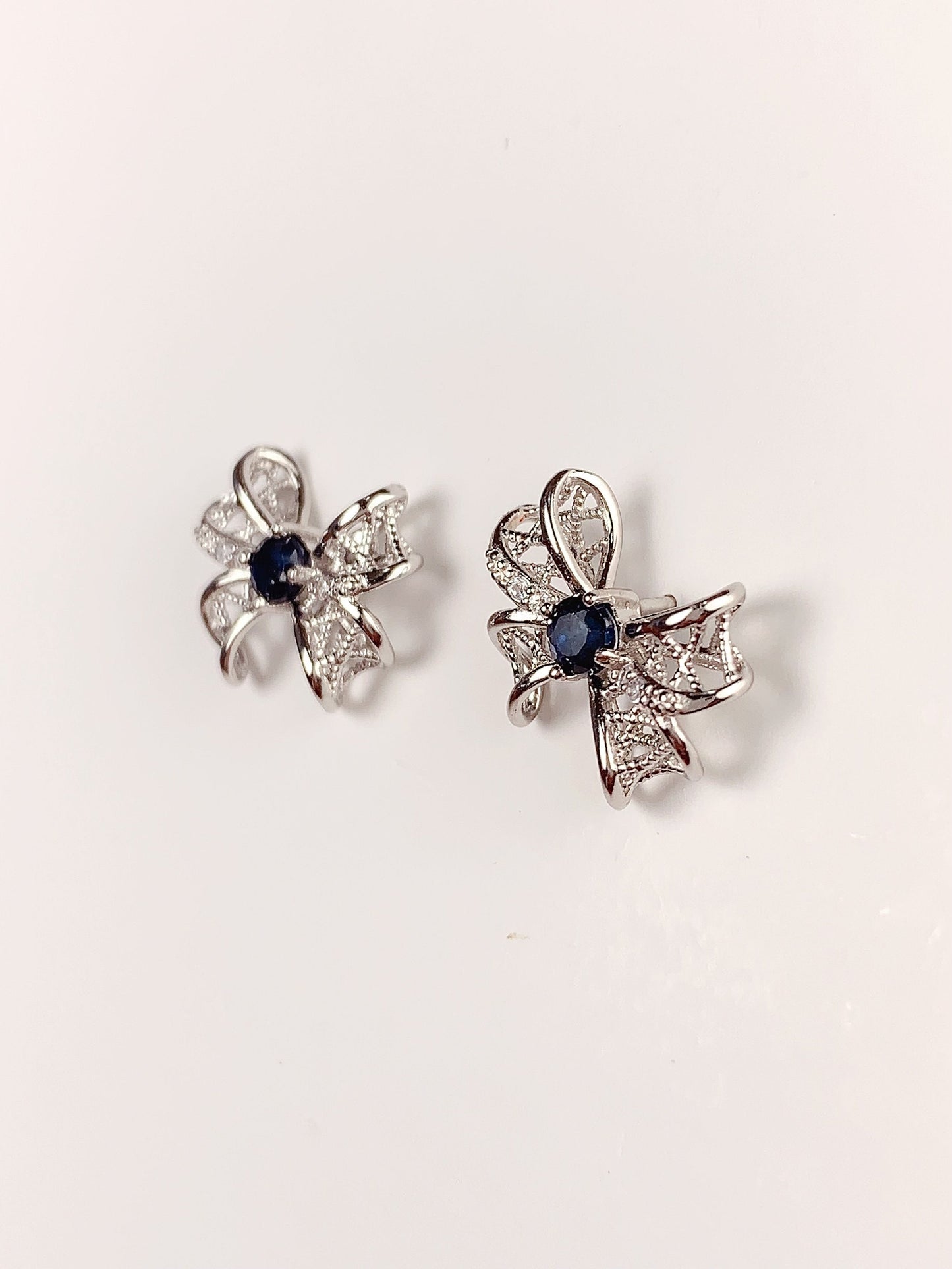 Blue Sapphire Sterling Silver Earrings: 18K White Gold Plated Bow
