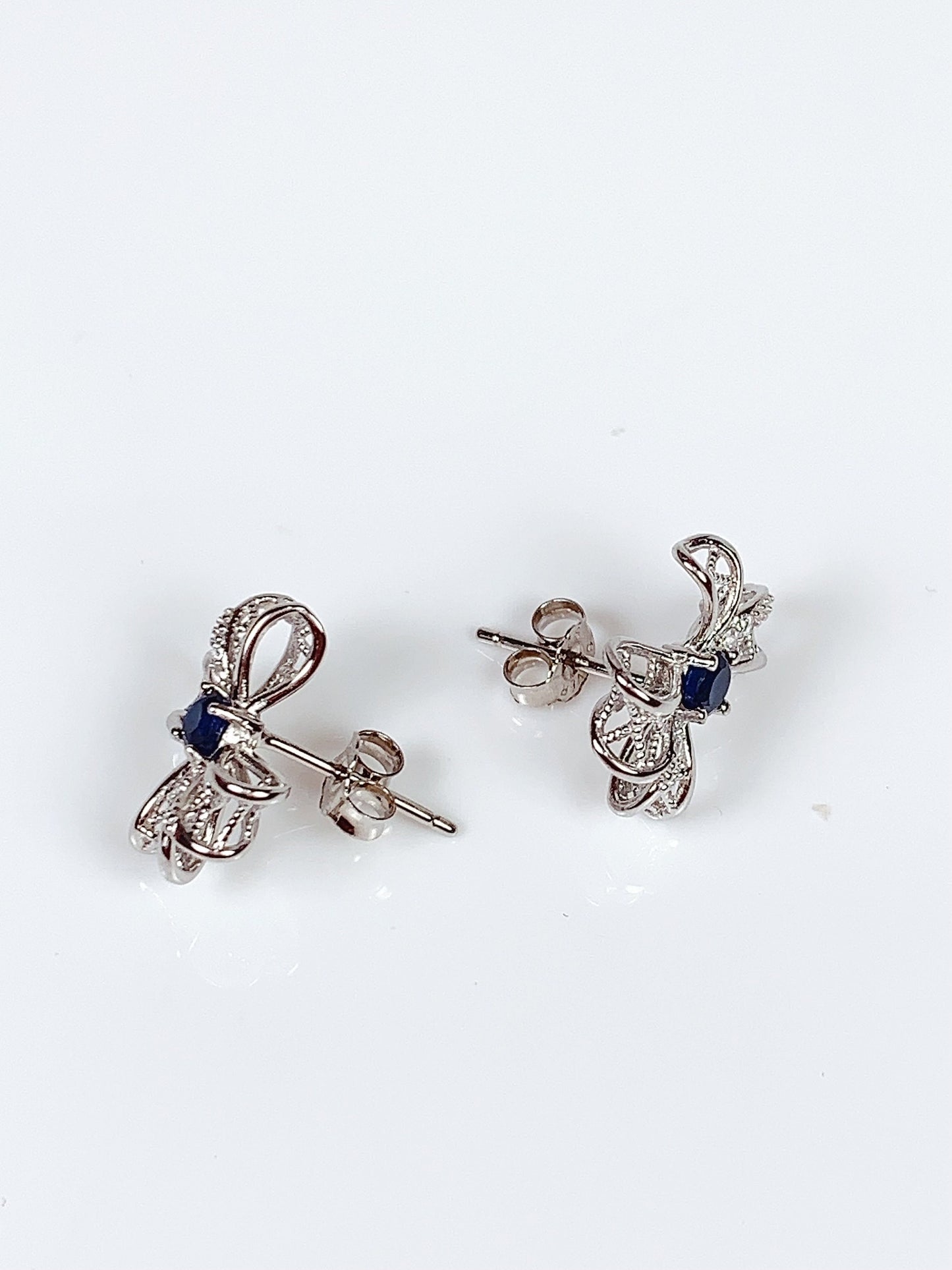 Blue Sapphire Sterling Silver Earrings: 18K White Gold Plated Bow