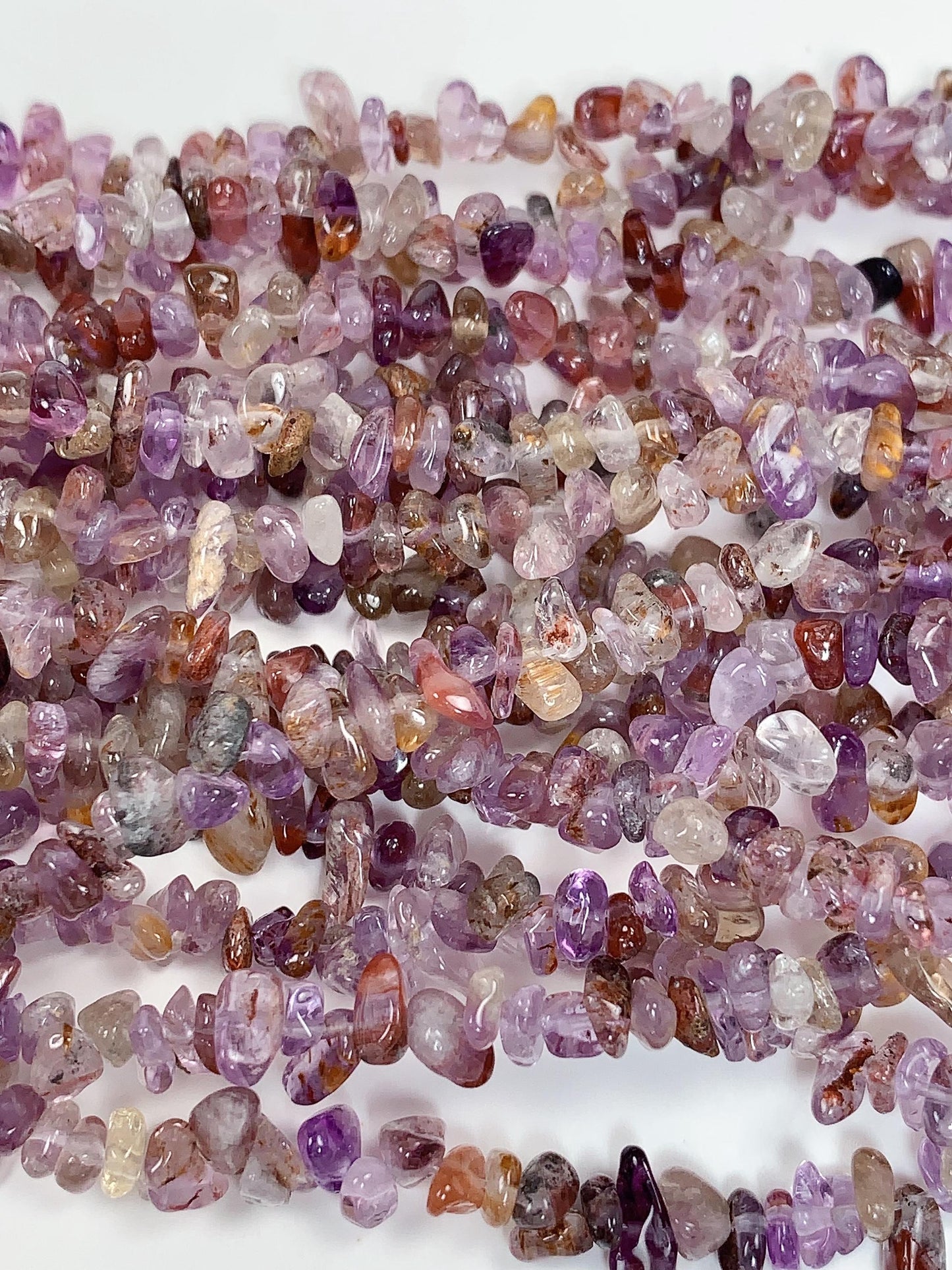 Super 7 Crystal Chip Beads: Natural Amethyst Cacoxenite Quartz (32" Strand)