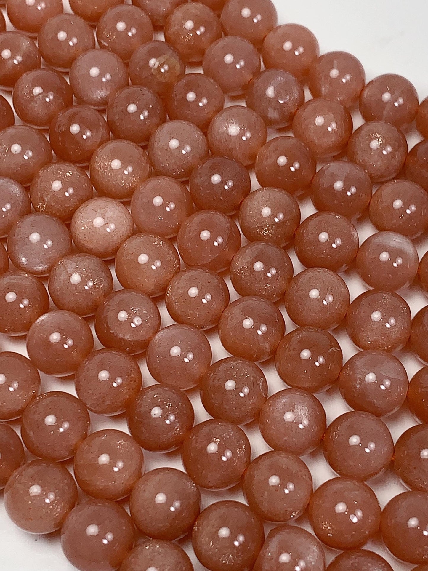 AAA Golden Peach Sunstone Beads: 15.5" Smooth Round Strand