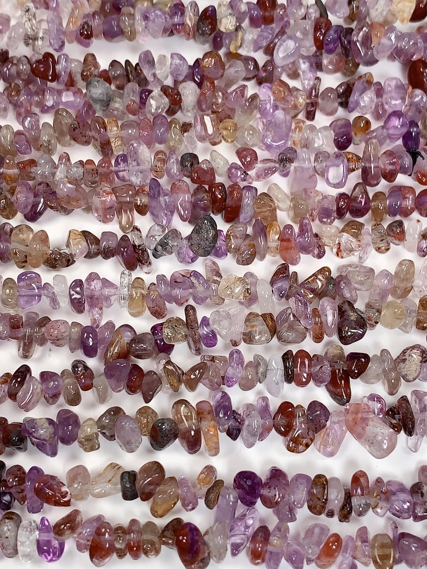 Super 7 Crystal Chip Beads: Natural Amethyst Cacoxenite Quartz (32" Strand)