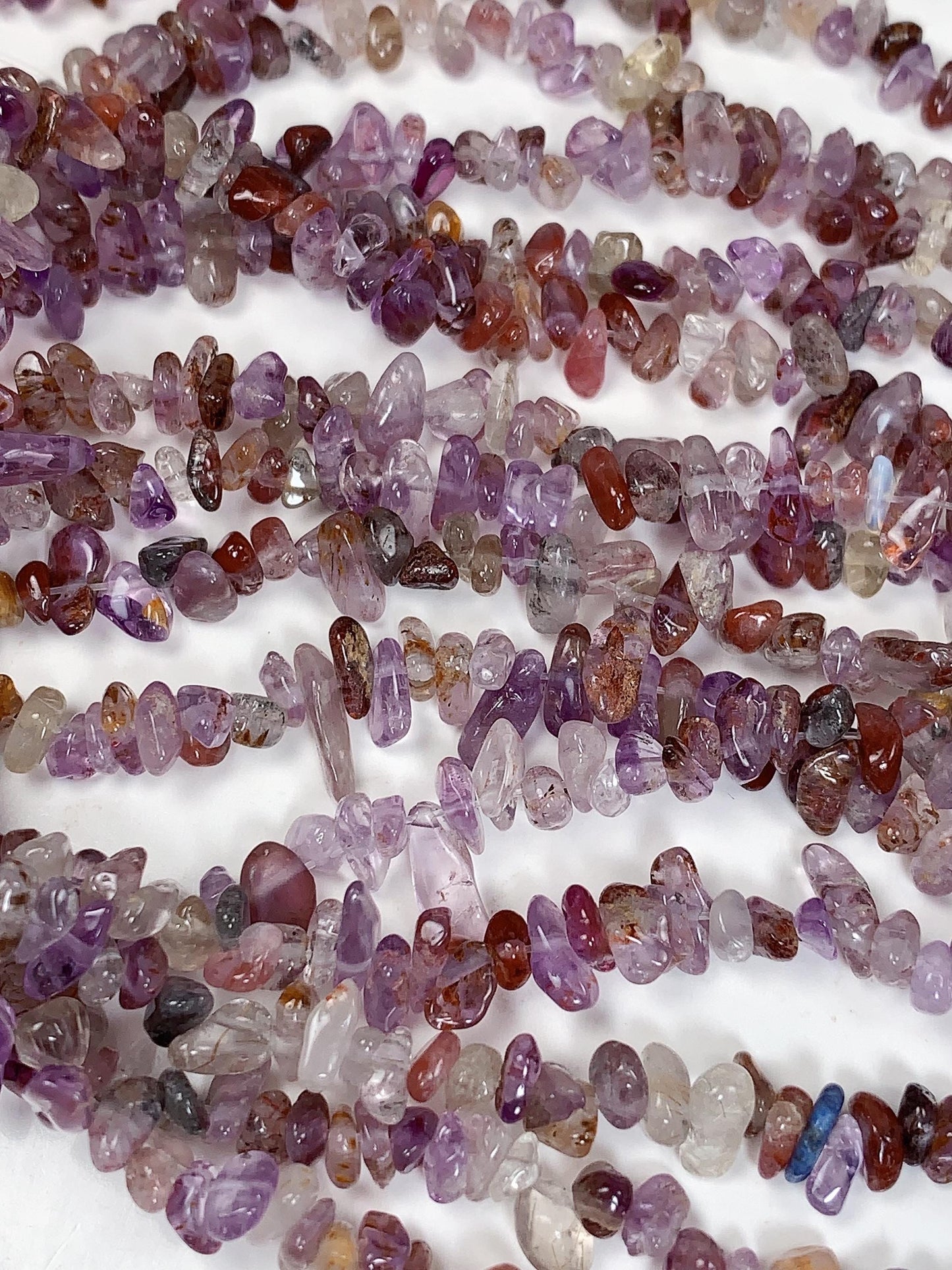 Super 7 Crystal Chip Beads: Natural Amethyst Cacoxenite Quartz (32" Strand)
