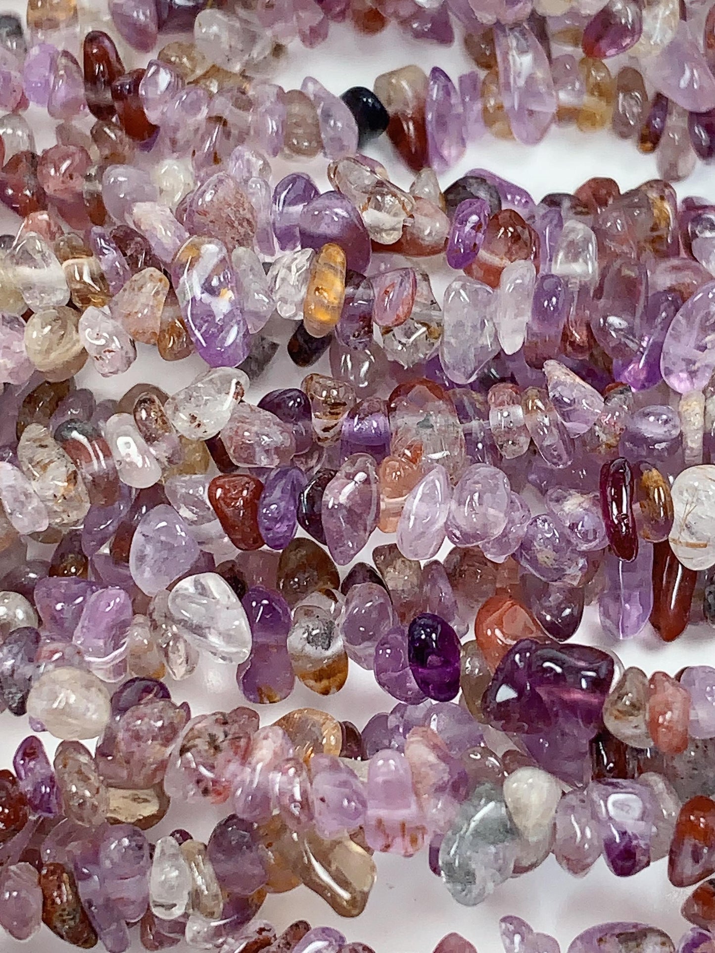 Super 7 Crystal Chip Beads: Natural Amethyst Cacoxenite Quartz (32" Strand)