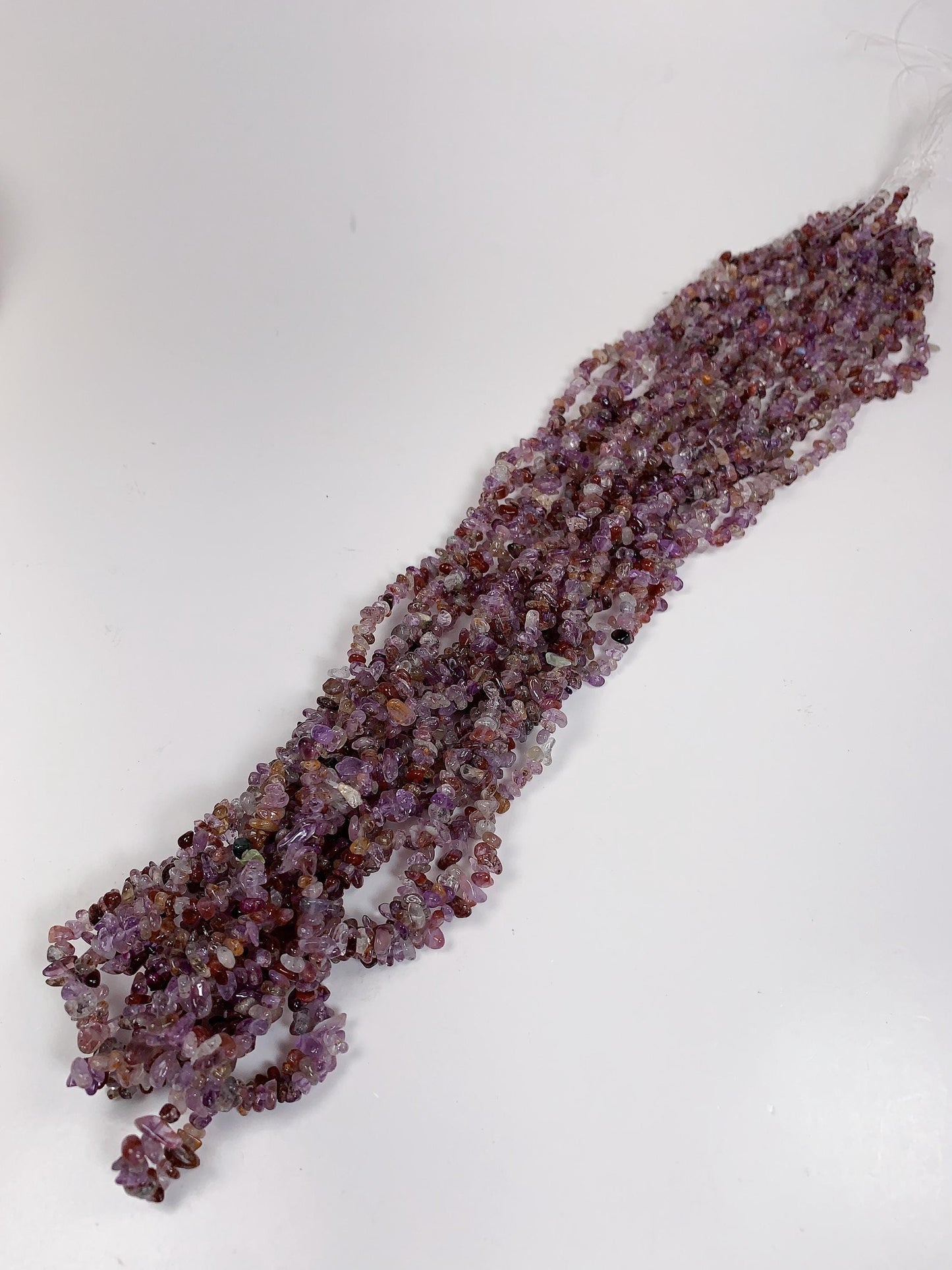 Super 7 Crystal Chip Beads: Natural Amethyst Cacoxenite Quartz (32" Strand)