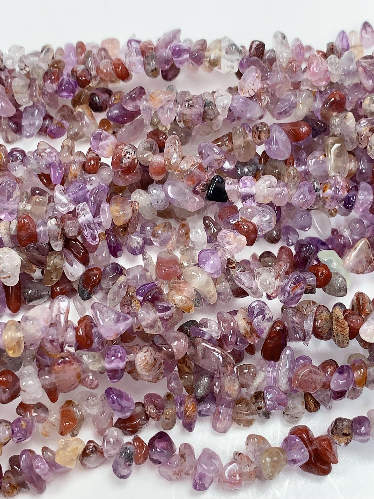 Super 7 Crystal Chip Beads: Natural Amethyst Cacoxenite Quartz (32" Strand)