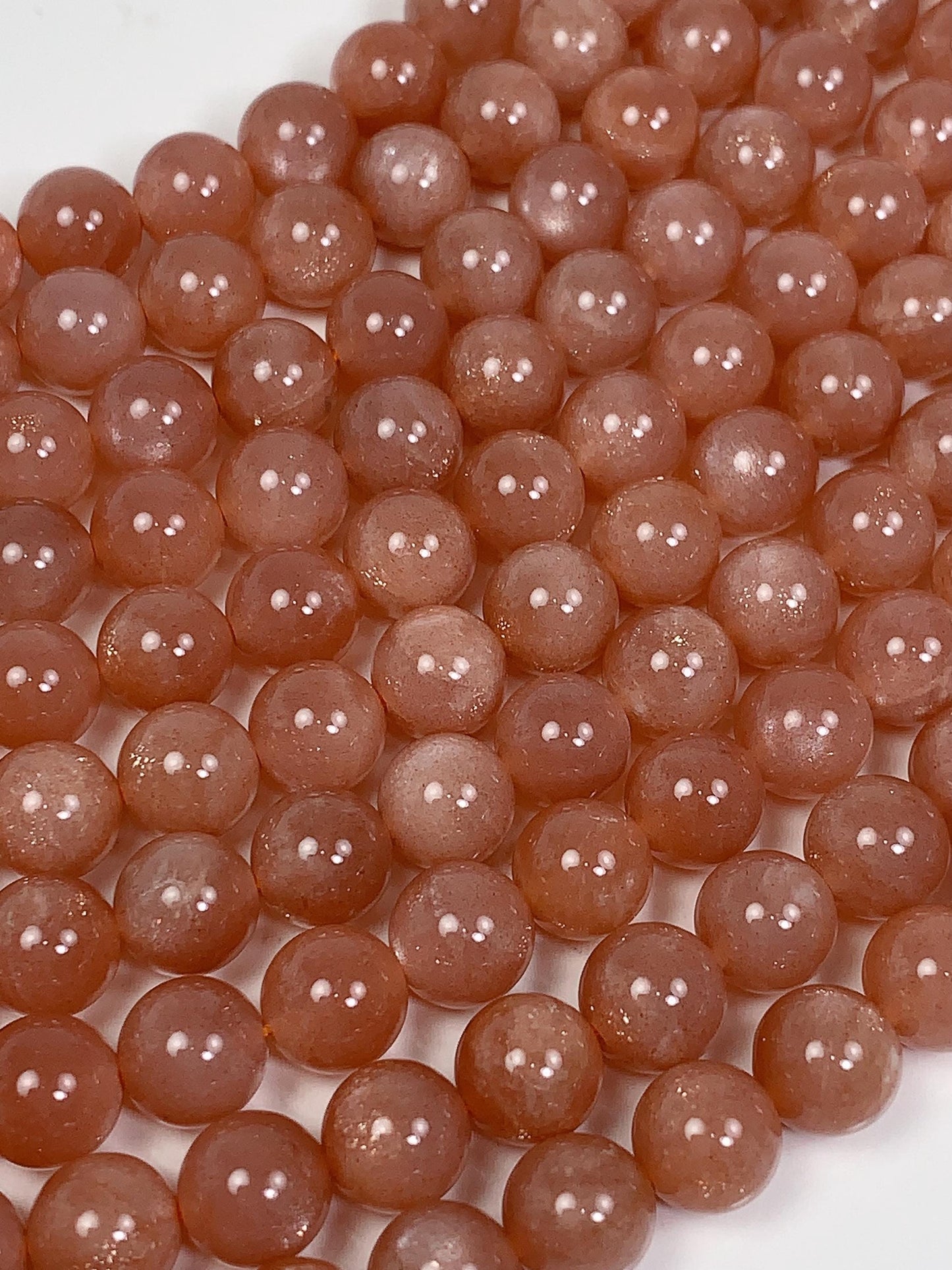 AAA Golden Peach Sunstone Beads: 15.5" Smooth Round Strand