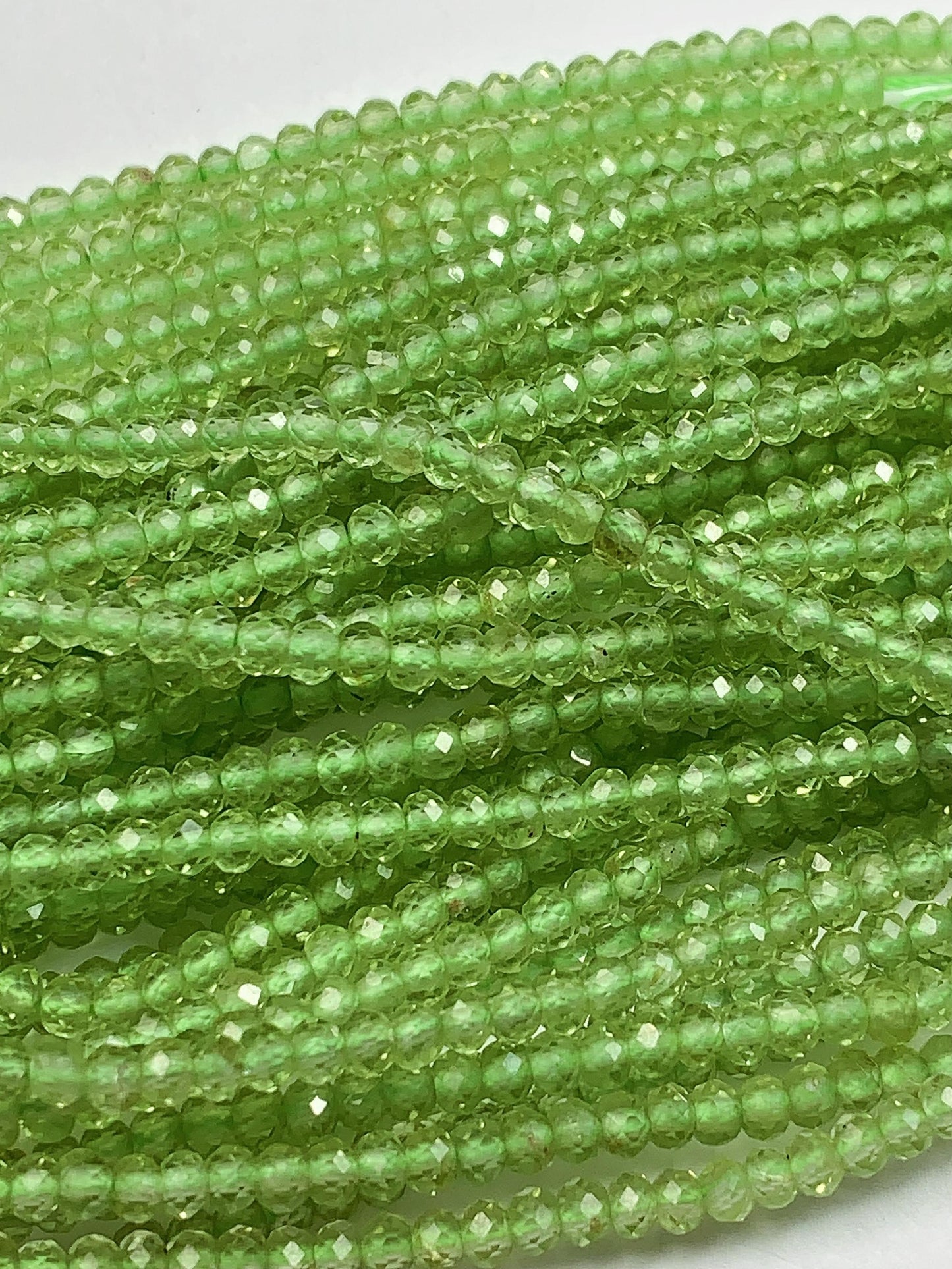 AAA Green Peridot Faceted Rondelle Beads: 2x3mm, 15.5" Strand