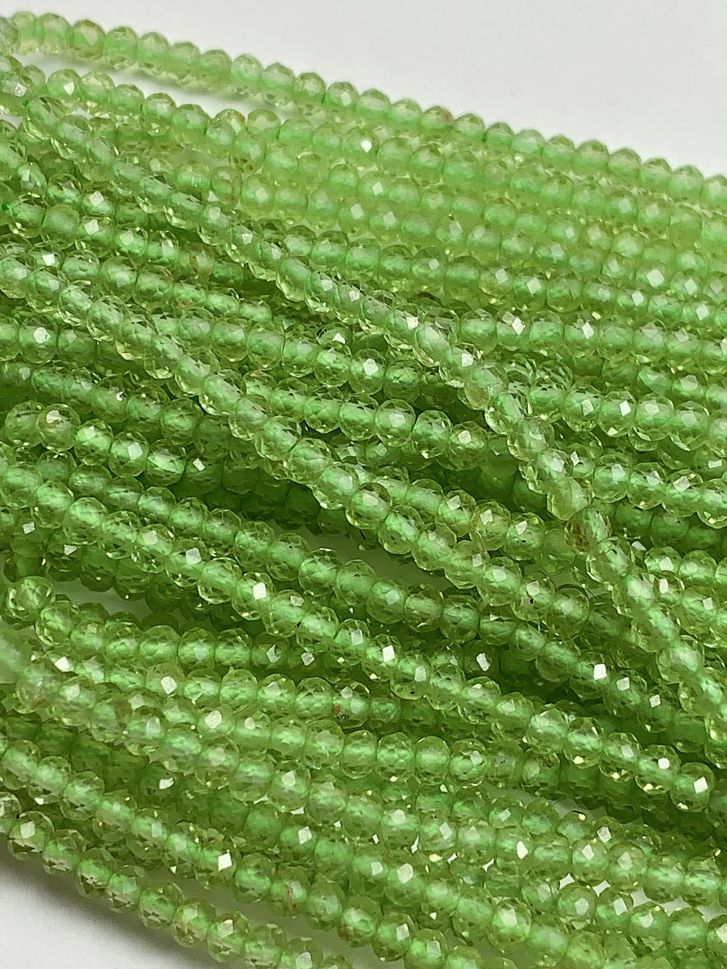 AAA Green Peridot Faceted Rondelle Beads: 2x3mm, 15.5" Strand