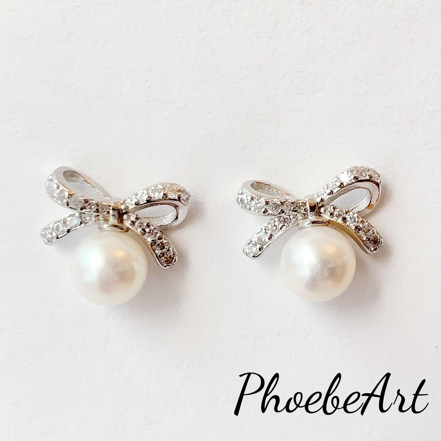 Freshwater Pearl Earrings: 18K White Gold Plated Sterling Silver Bow Studs