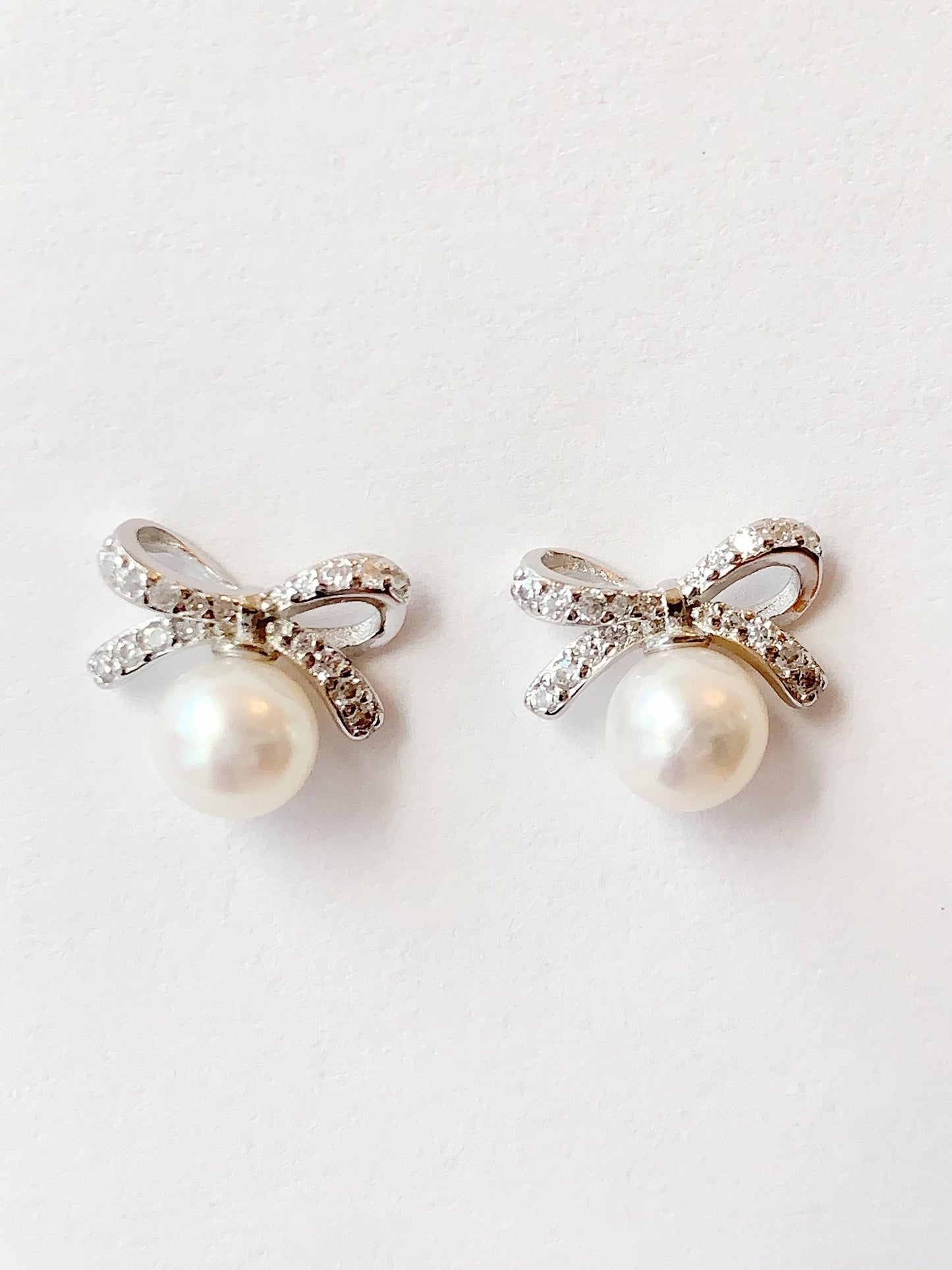Freshwater Pearl Earrings: 18K White Gold Plated Sterling Silver Bow Studs