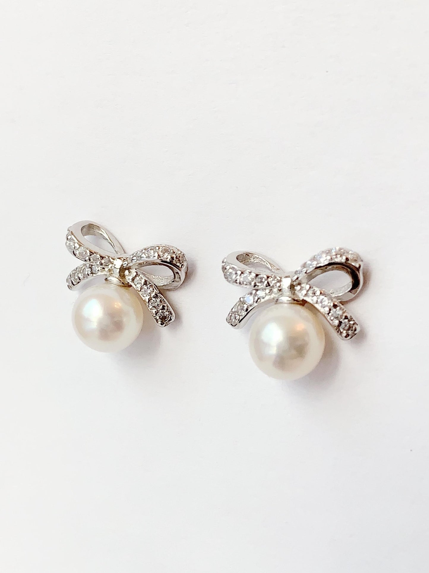Freshwater Pearl Earrings: 18K White Gold Plated Sterling Silver Bow Studs
