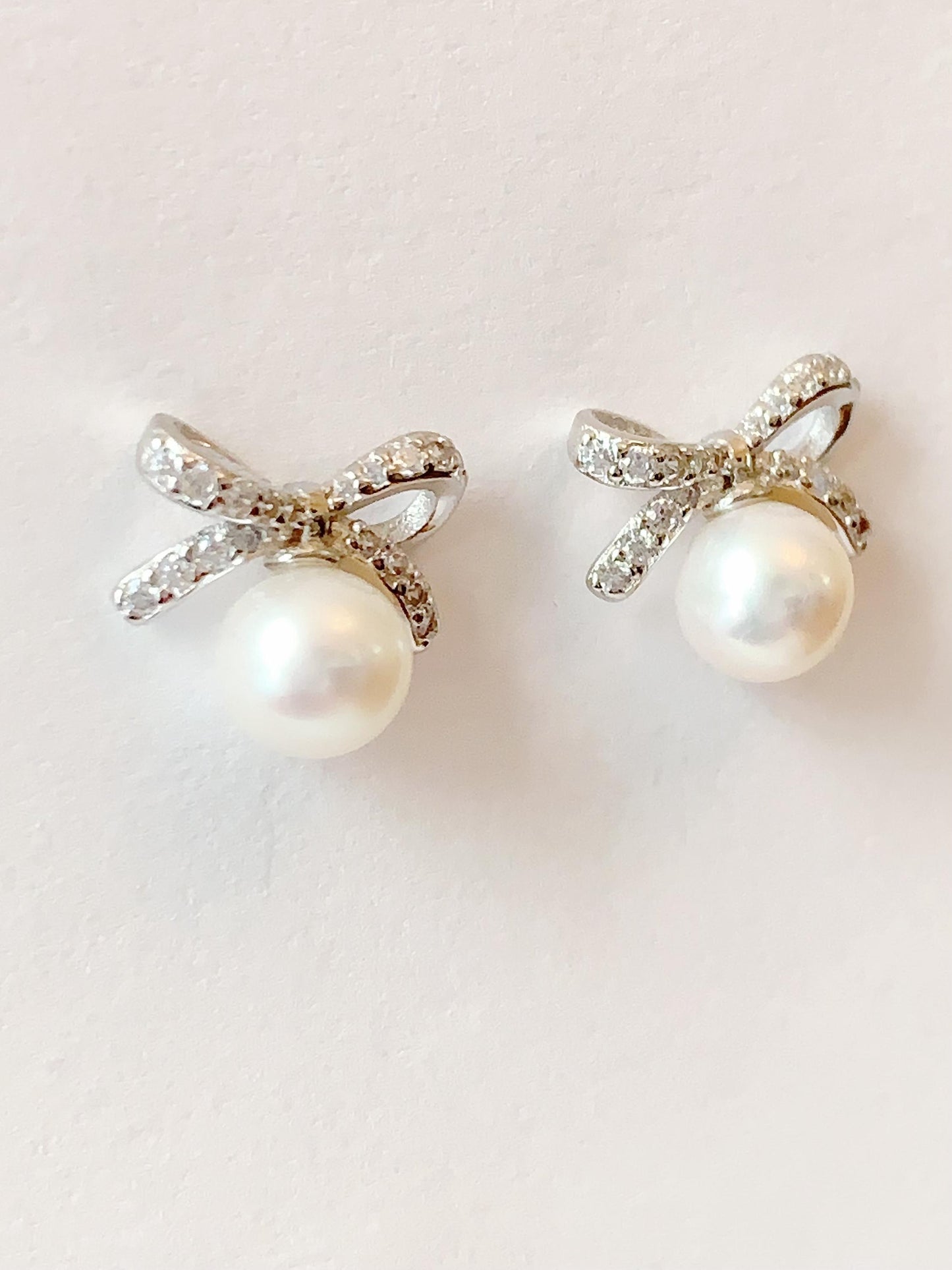 Freshwater Pearl Earrings: 18K White Gold Plated Sterling Silver Bow Studs