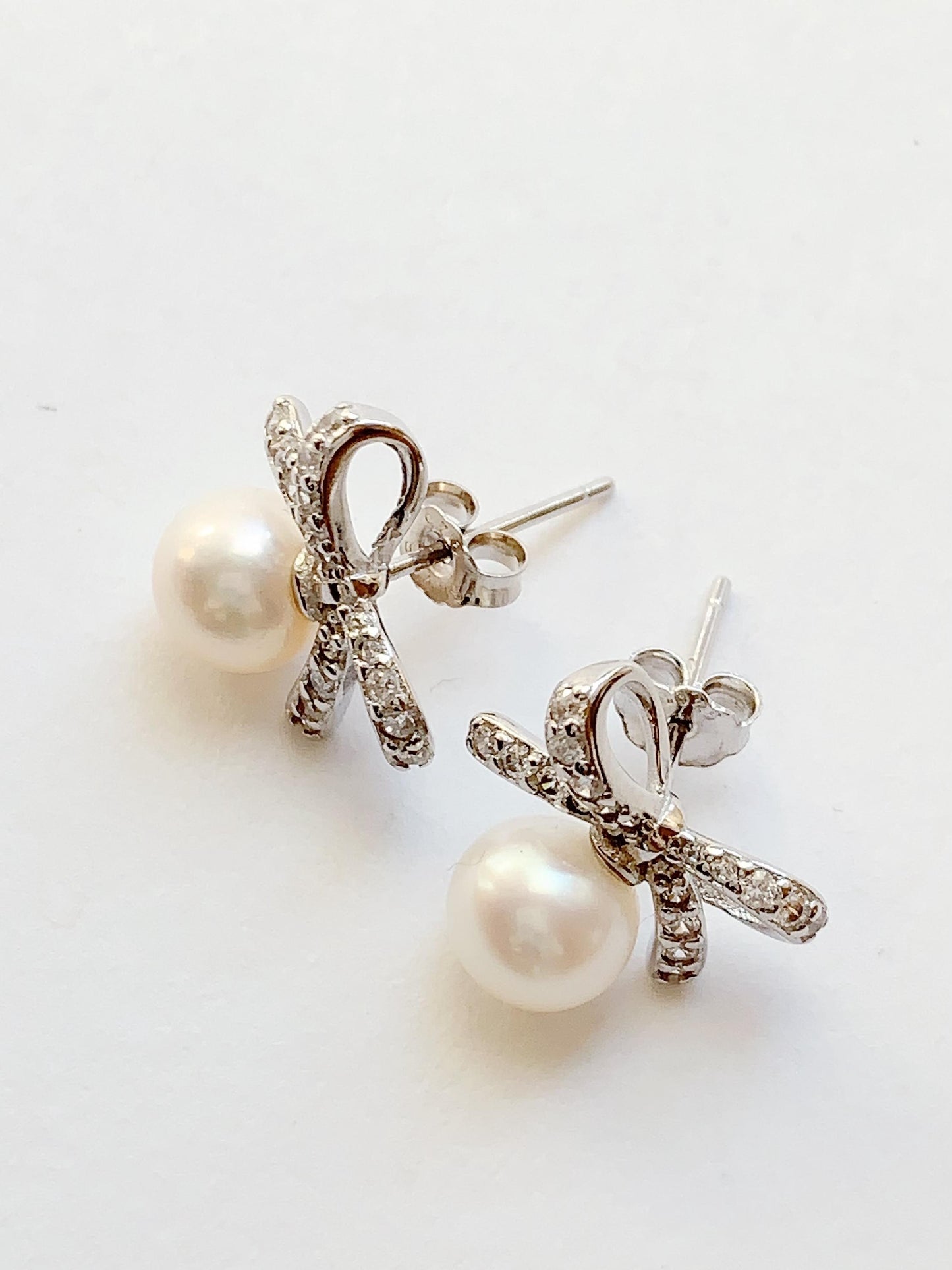 Freshwater Pearl Earrings: 18K White Gold Plated Sterling Silver Bow Studs