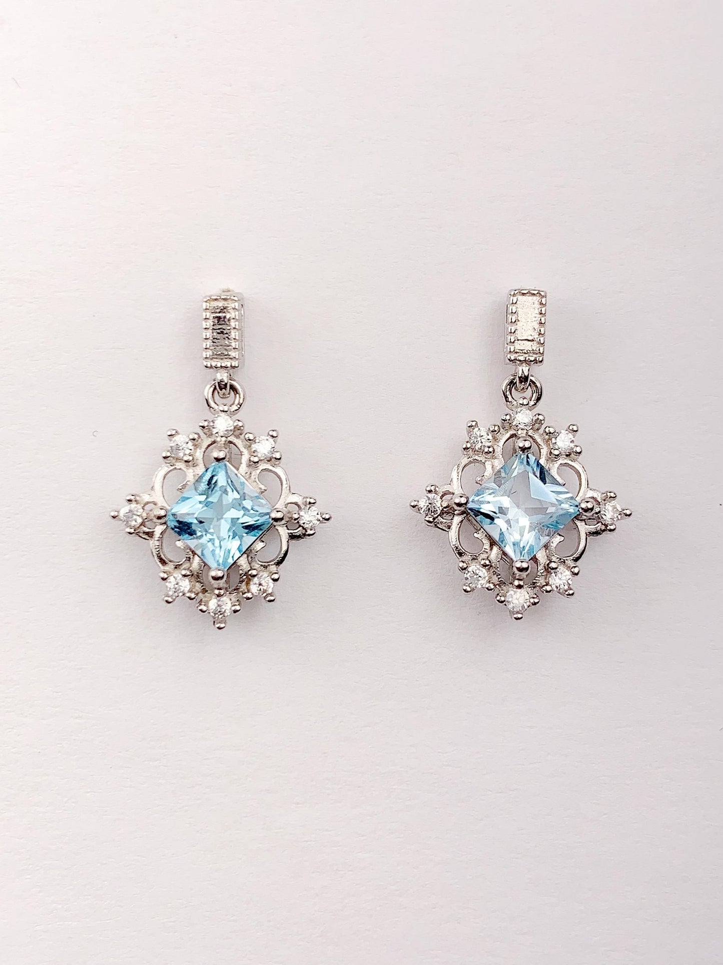 Blue Topaz Sterling Silver Earrings: 18k White Gold Plated Studs