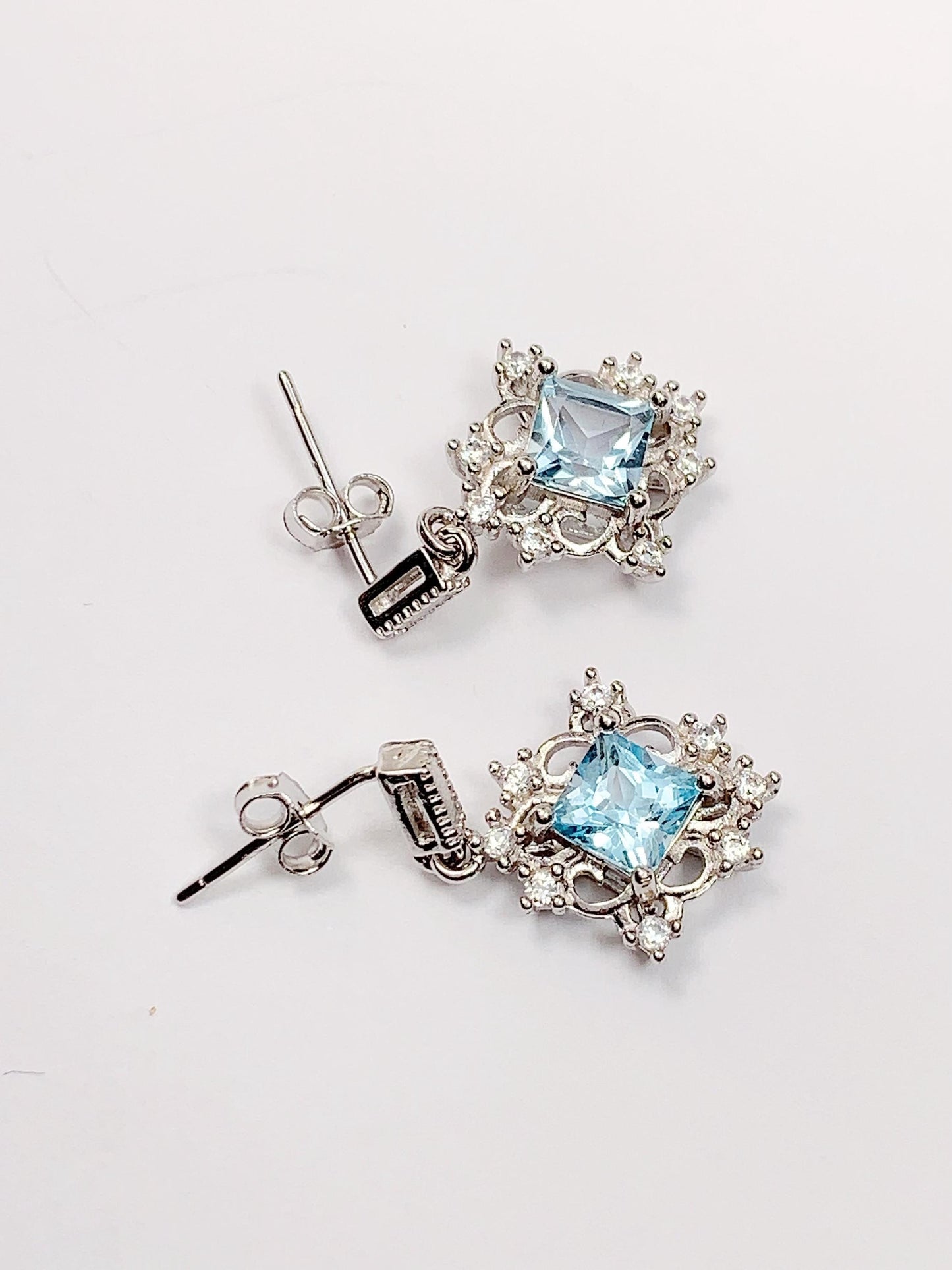 Blue Topaz Sterling Silver Earrings: 18k White Gold Plated Studs