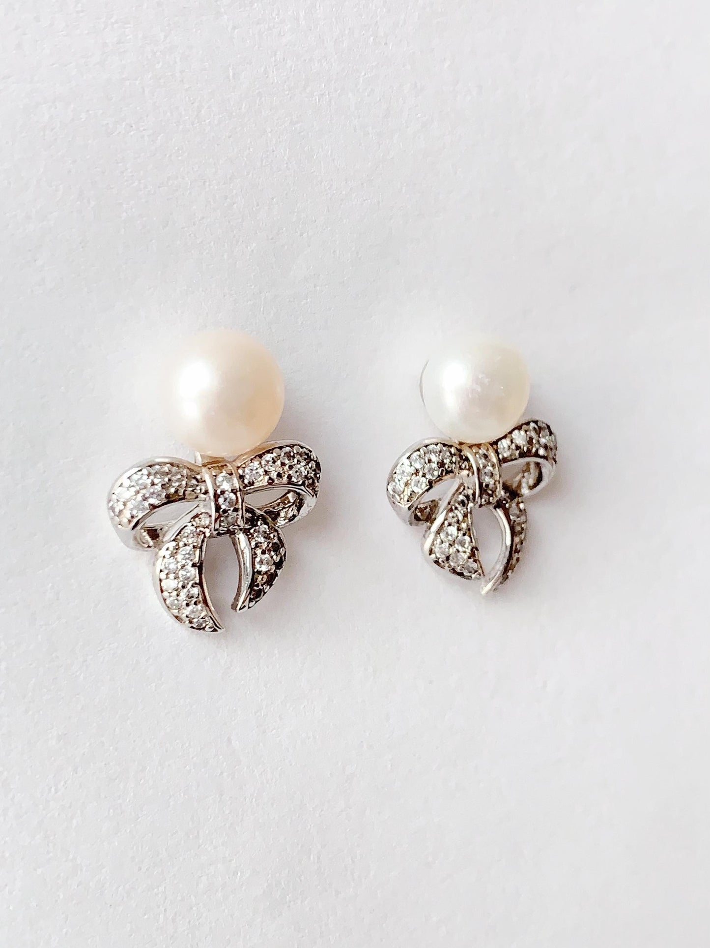 Freshwater Pearl Earrings: 18K White Gold Plated Sterling Silver Bow Studs