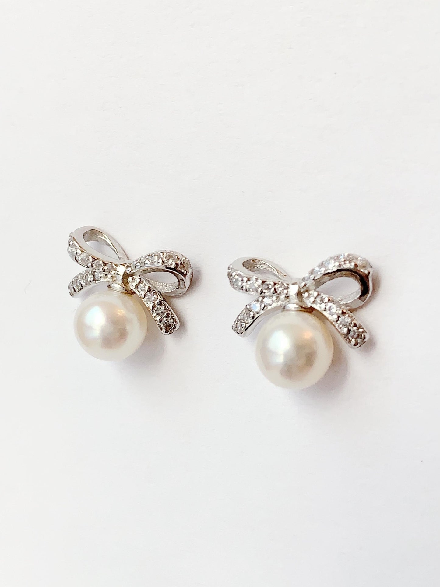 Freshwater Pearl Earrings: 18K White Gold Plated Sterling Silver Bow Studs