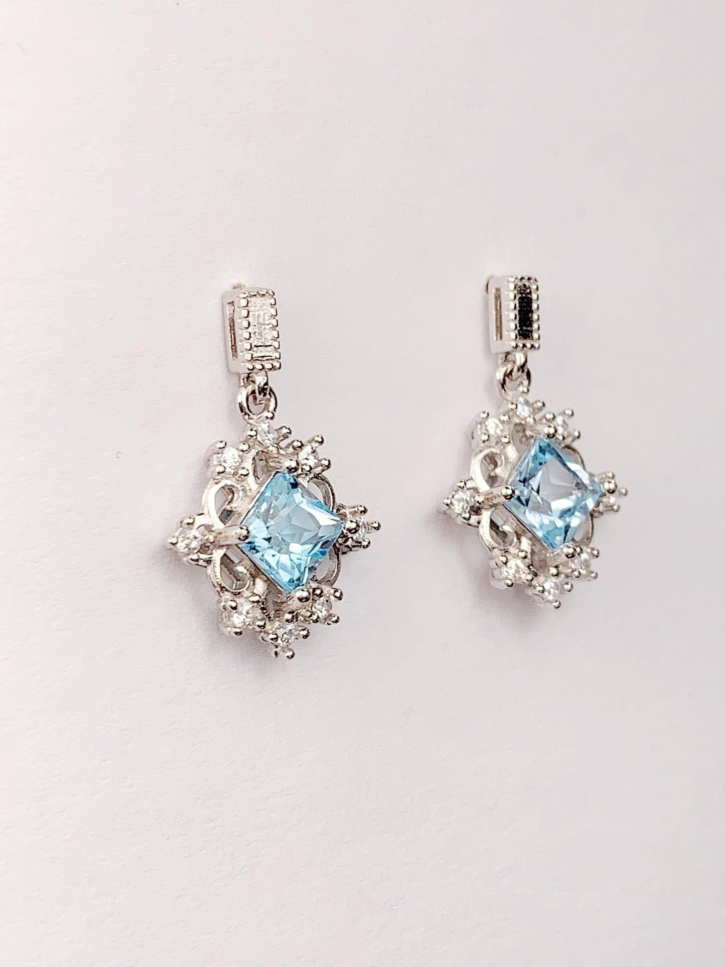 Blue Topaz Sterling Silver Earrings: 18k White Gold Plated Studs