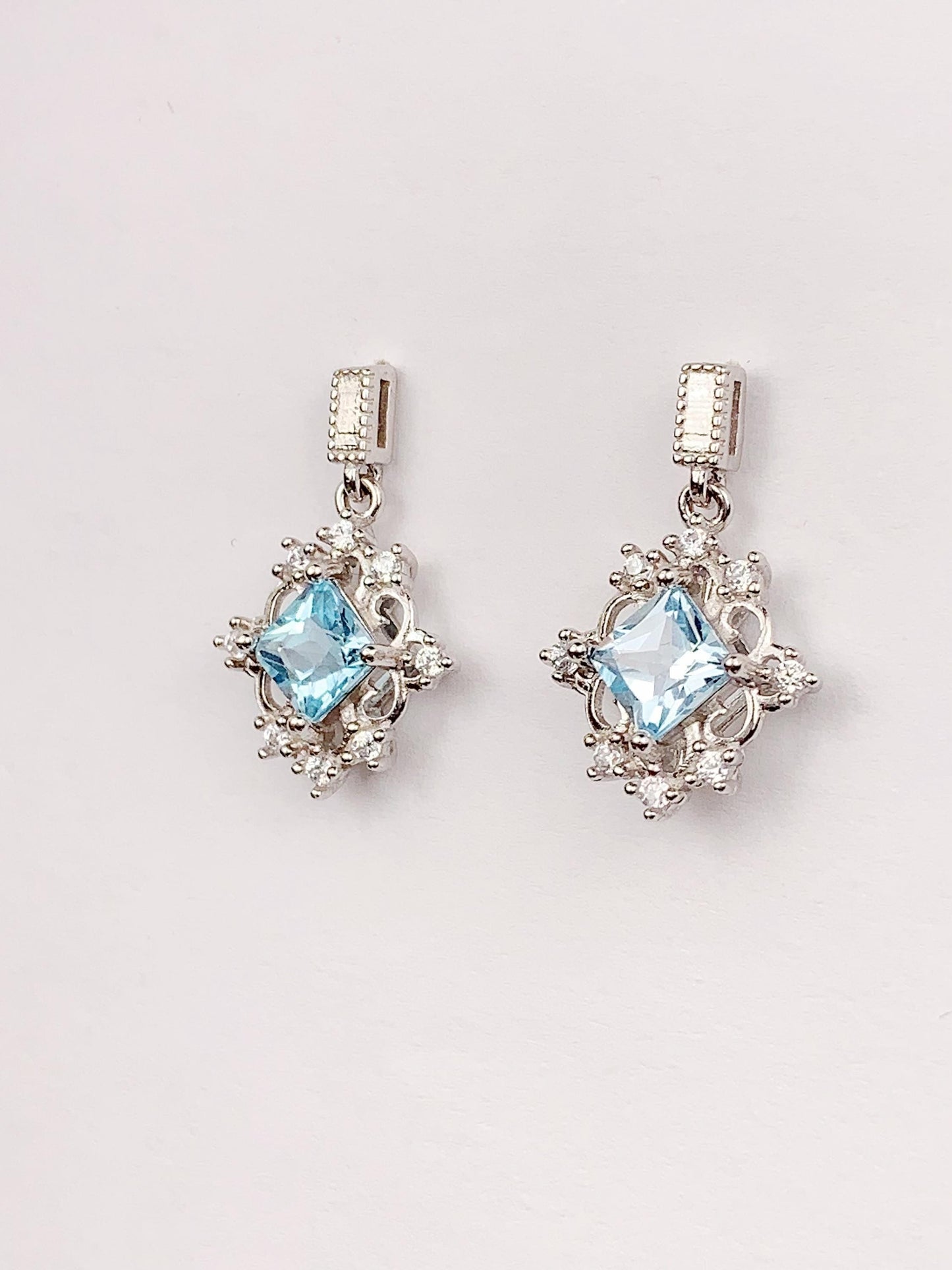 Blue Topaz Sterling Silver Earrings: 18k White Gold Plated Studs