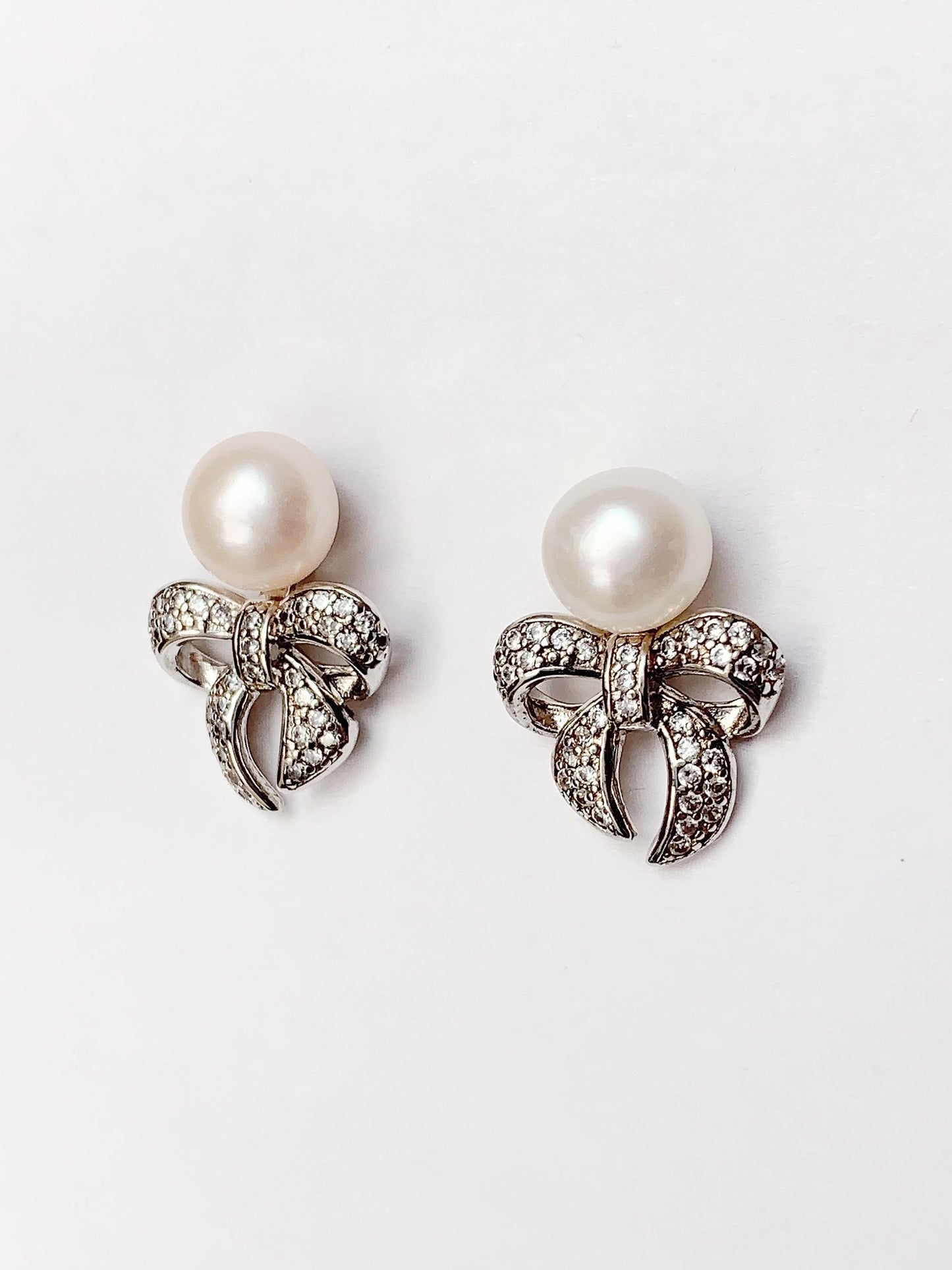 Freshwater Pearl Earrings: 18K White Gold Plated Sterling Silver Bow Studs
