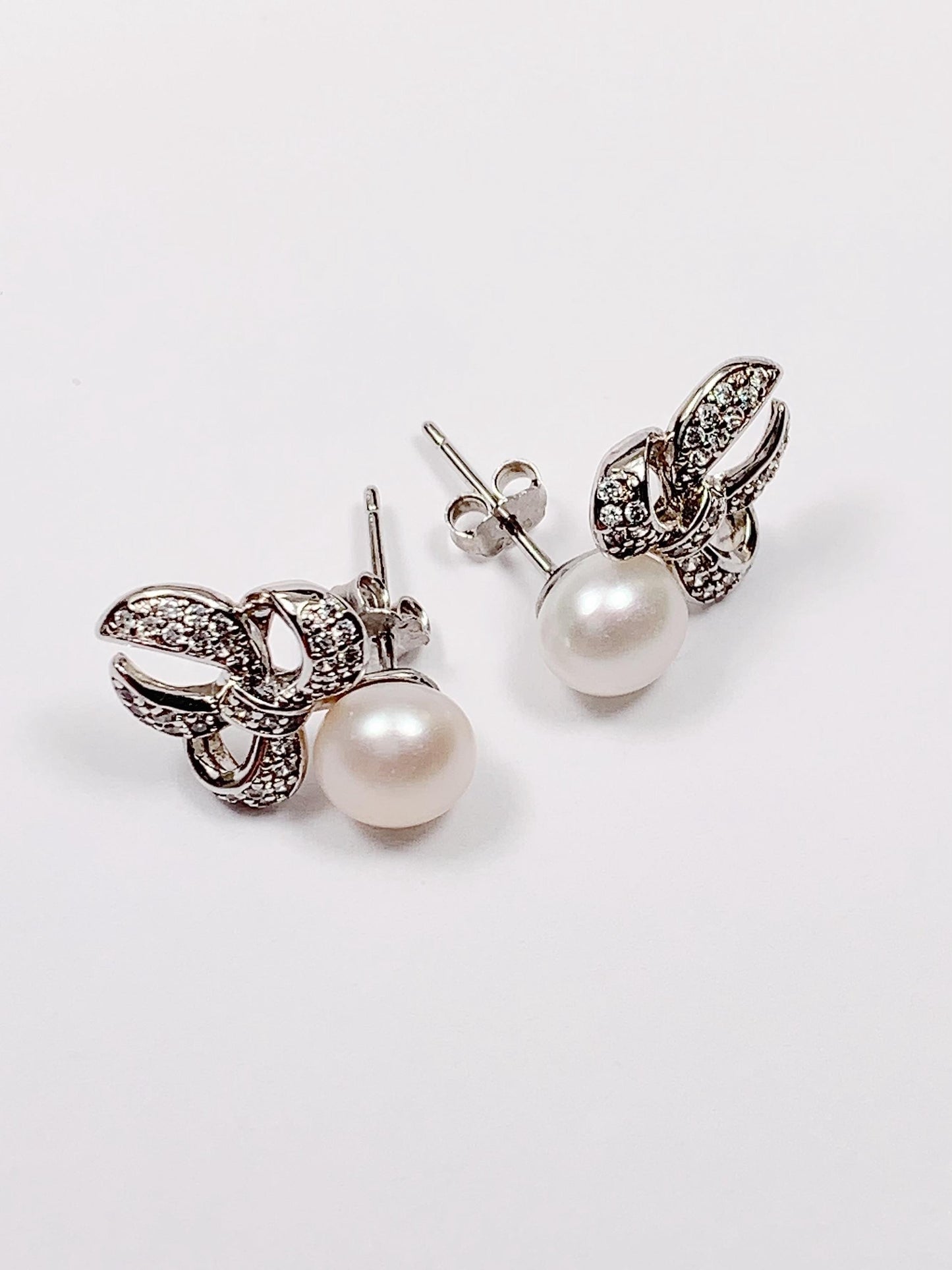 Freshwater Pearl Earrings: 18K White Gold Plated Sterling Silver Bow Studs