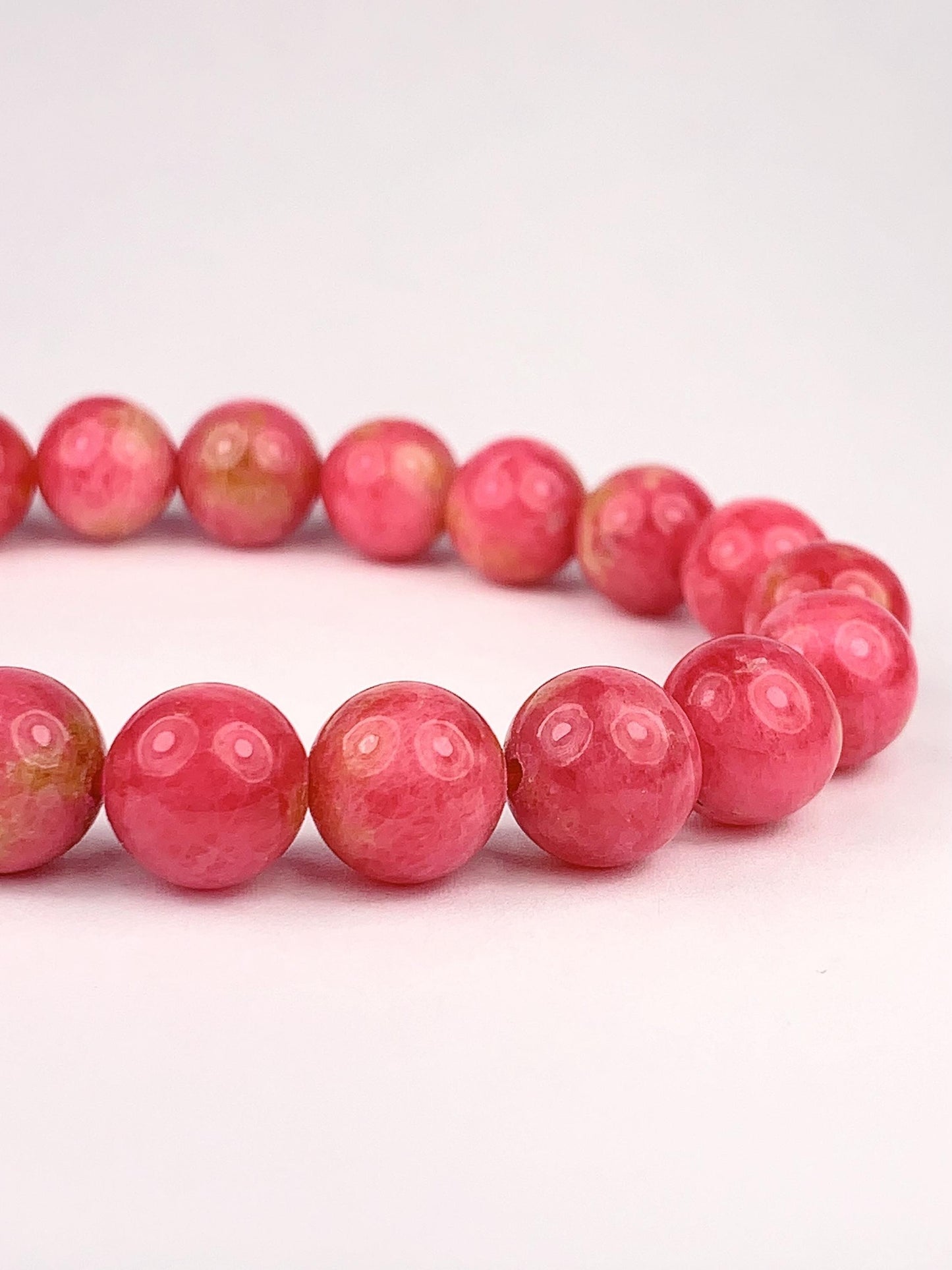 Natural Pink Rhodonite Bracelet: Golden Smooth Round Gemstone (9mm)