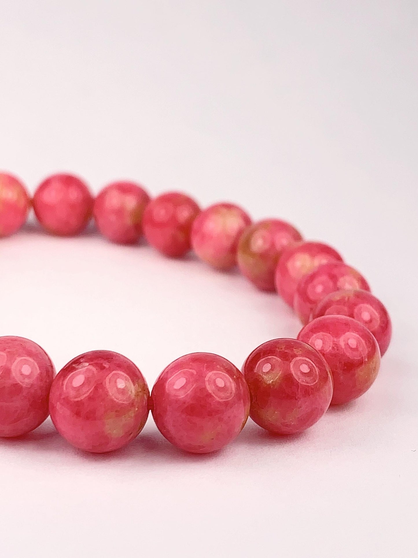 Natural Pink Rhodonite Bracelet: Golden Smooth Round Gemstone (9mm)