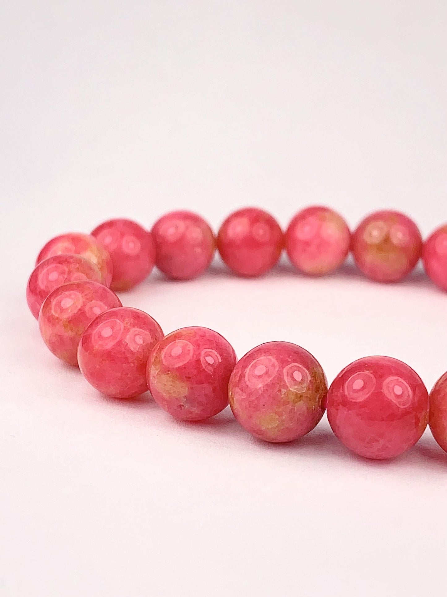 Natural Pink Rhodonite Bracelet: Golden Smooth Round Gemstone (9mm)