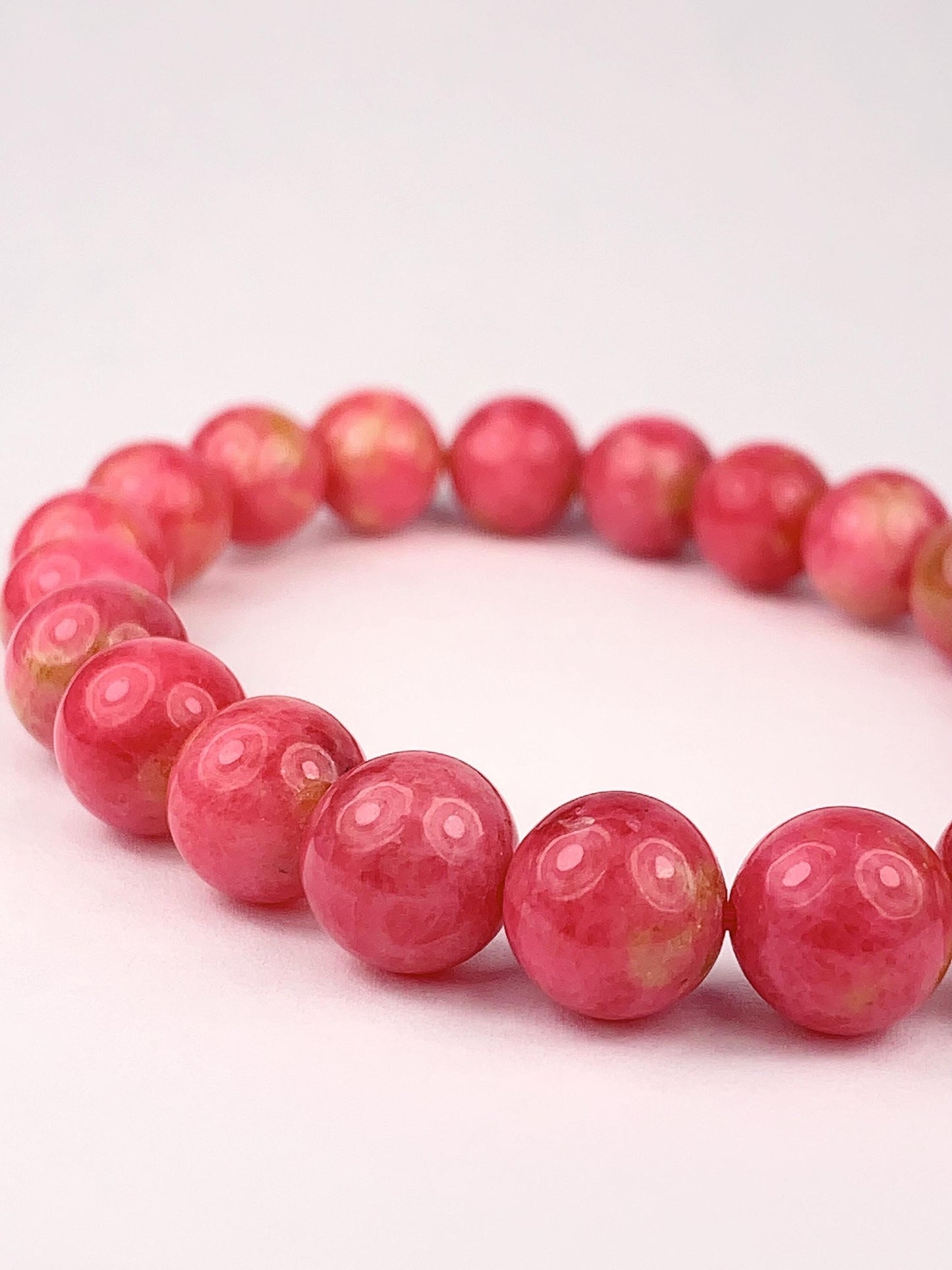 Natural Pink Rhodonite Bracelet: Golden Smooth Round Gemstone (9mm)